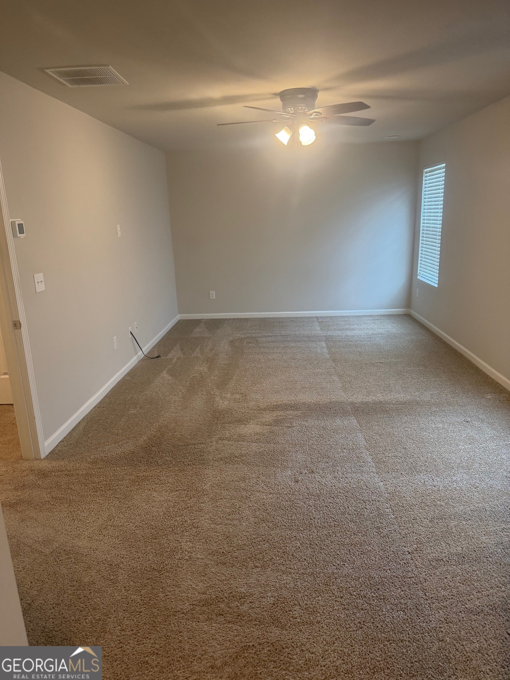 399 Toronto Circle, Unit 281 Hampton, GA 30228 - Photo 12 of 18 a view of empty room