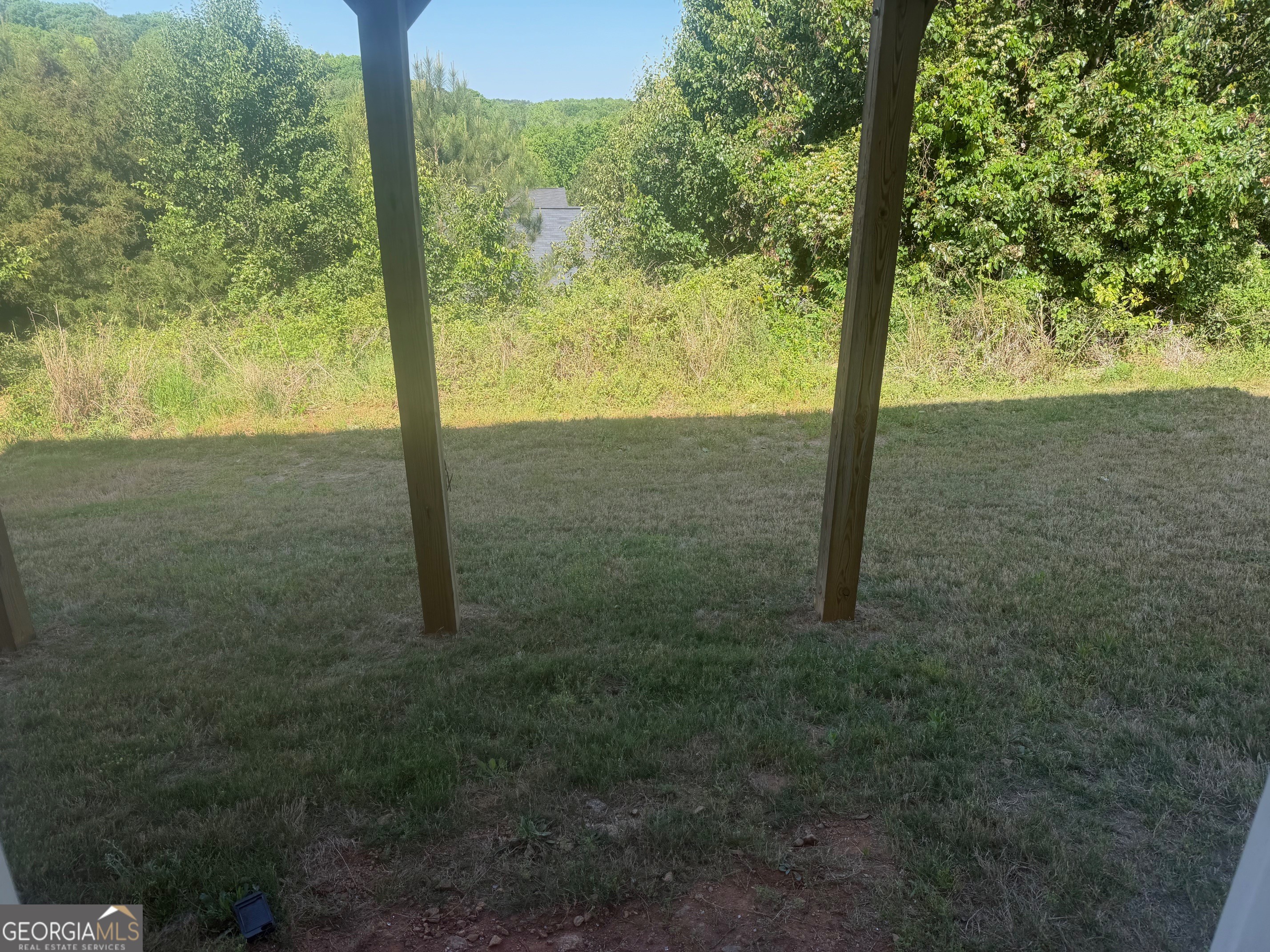 399 Toronto Circle, Unit 281 Hampton, GA 30228 - Photo 16 of 18 a view of a yard with a tree