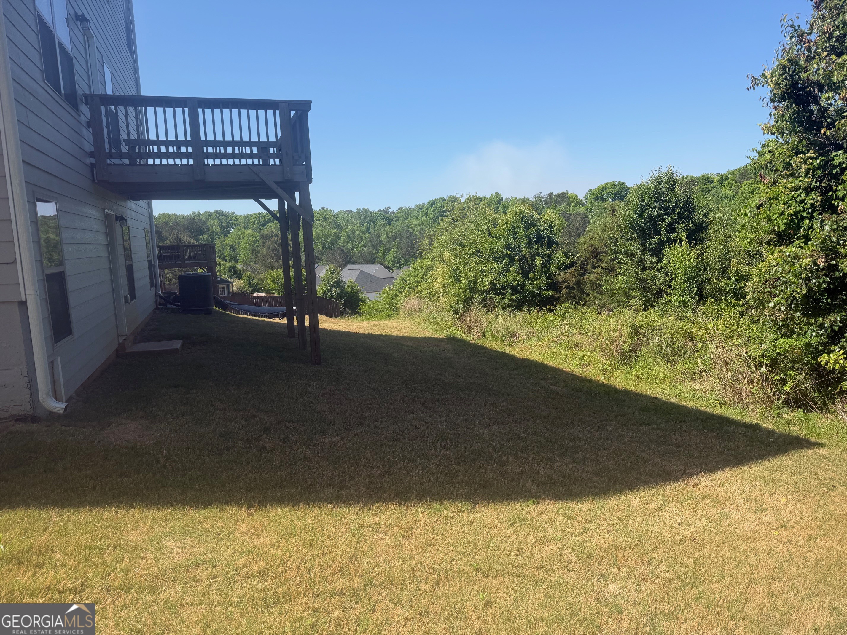 399 Toronto Circle, Unit 281 Hampton, GA 30228 - Photo 17 of 18 a view of a house with a yard
