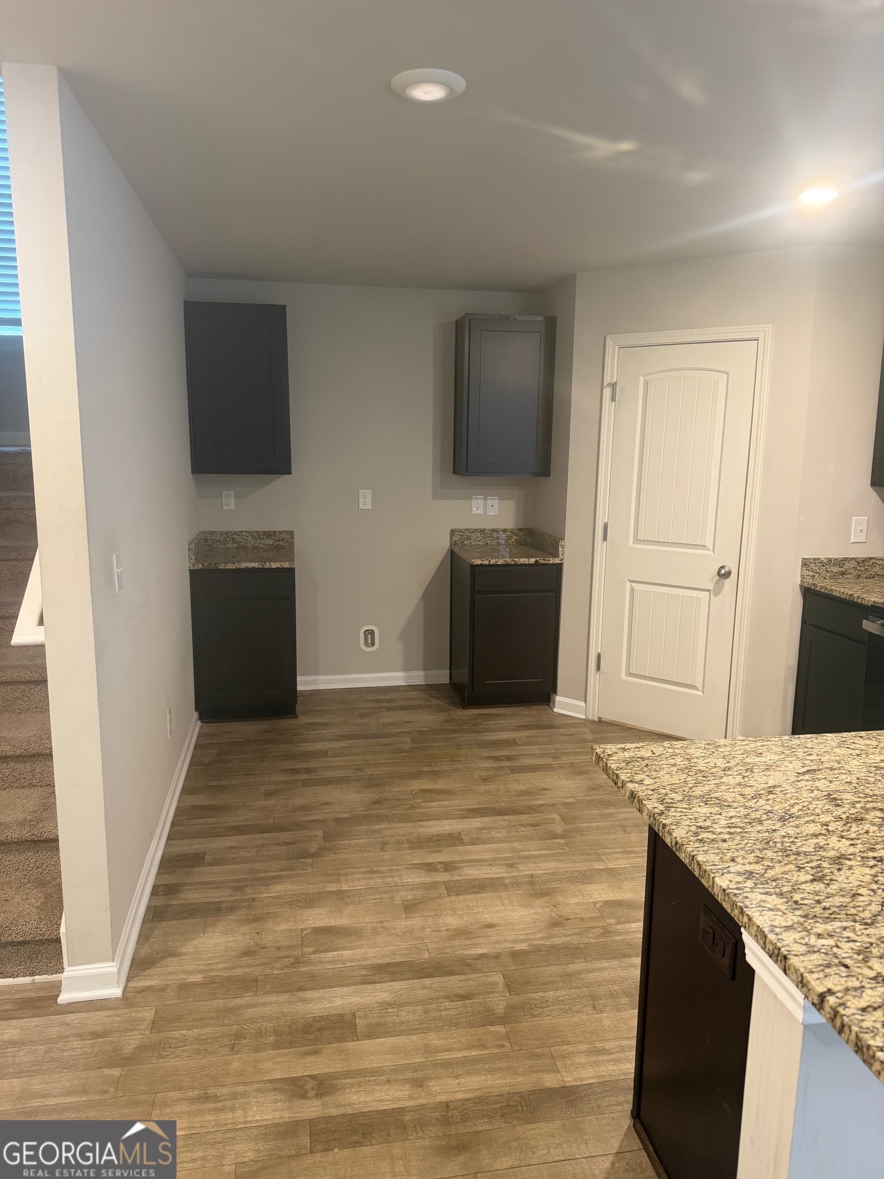 399 Toronto Circle, Unit 281 Hampton, GA 30228 - Photo 4 of 18 a view of kitchen with sink microwave and refrigerator