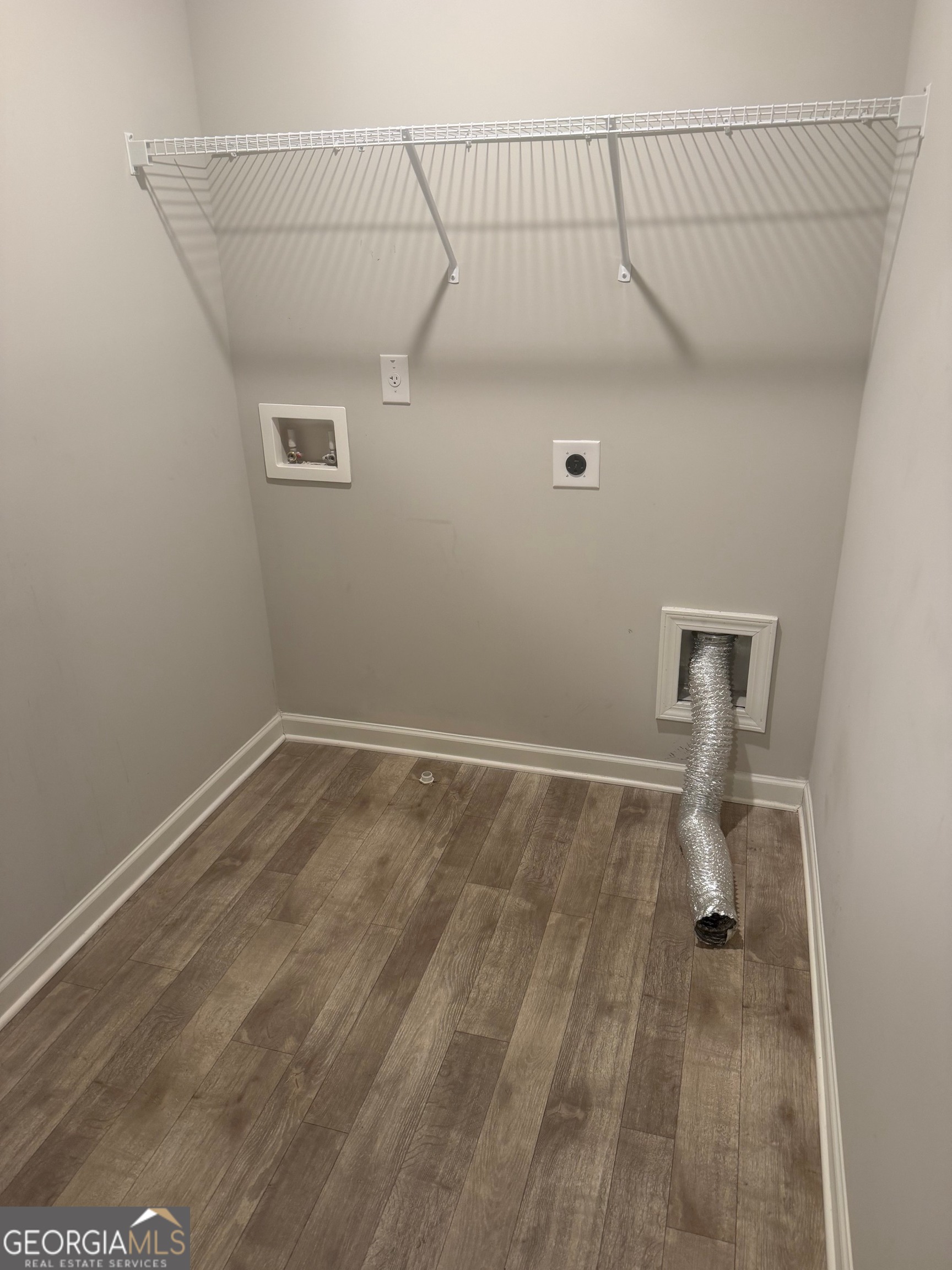 399 Toronto Circle, Unit 281 Hampton, GA 30228 - Photo 10 of 18 a view of a room with wooden floor