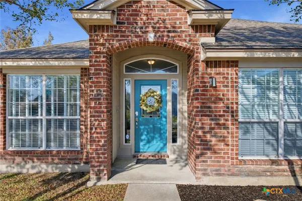 a front view of a house with large windows