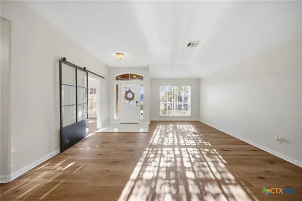 a view of an empty room and window