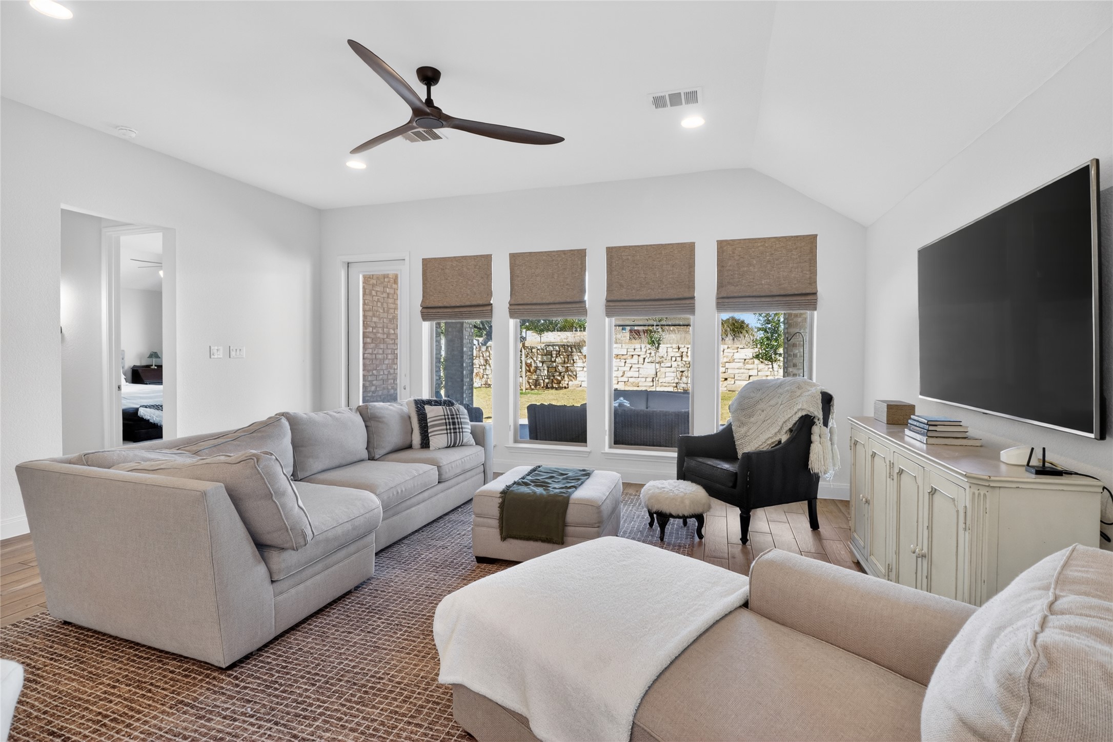100 Peach Orch Lane Georgetown, TX 78628 - Photo 11 of 40 a living room with furniture and a flat screen tv
