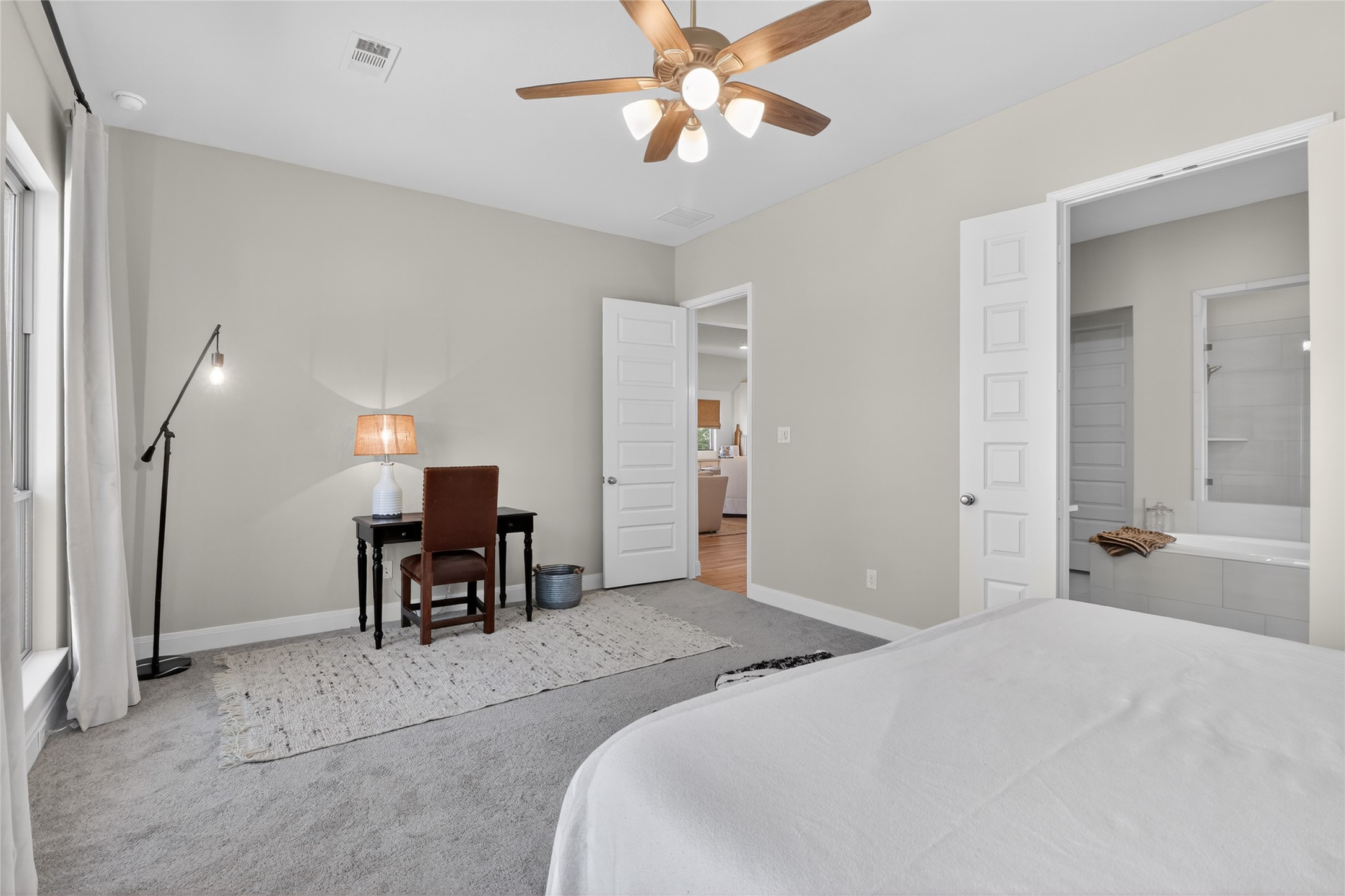 100 Peach Orch Lane Georgetown, TX 78628 - Photo 14 of 40 a bedroom with a bed table and chair