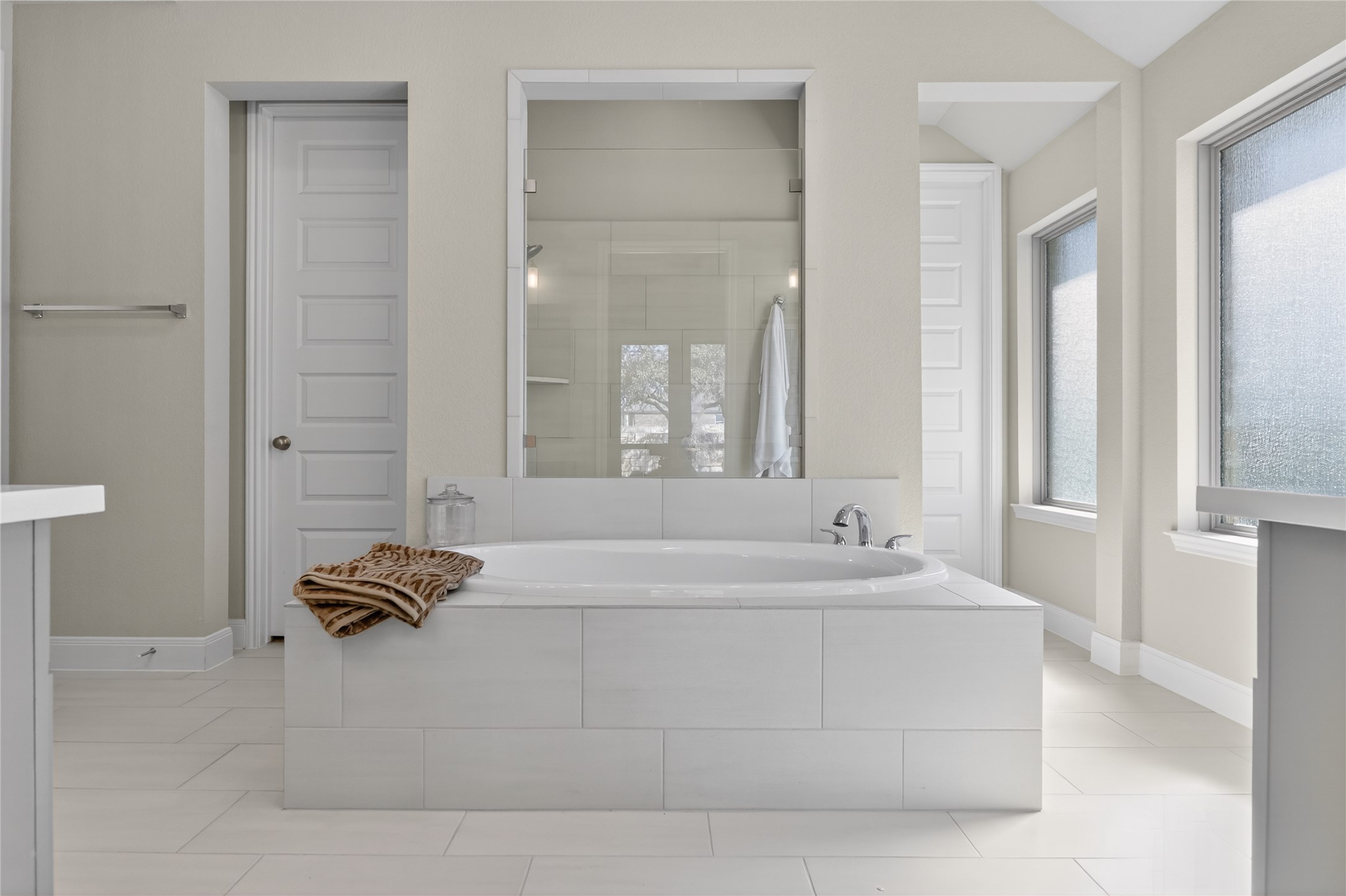 100 Peach Orch Lane Georgetown, TX 78628 - Photo 15 of 40 a bathroom with a bathtub and a shower