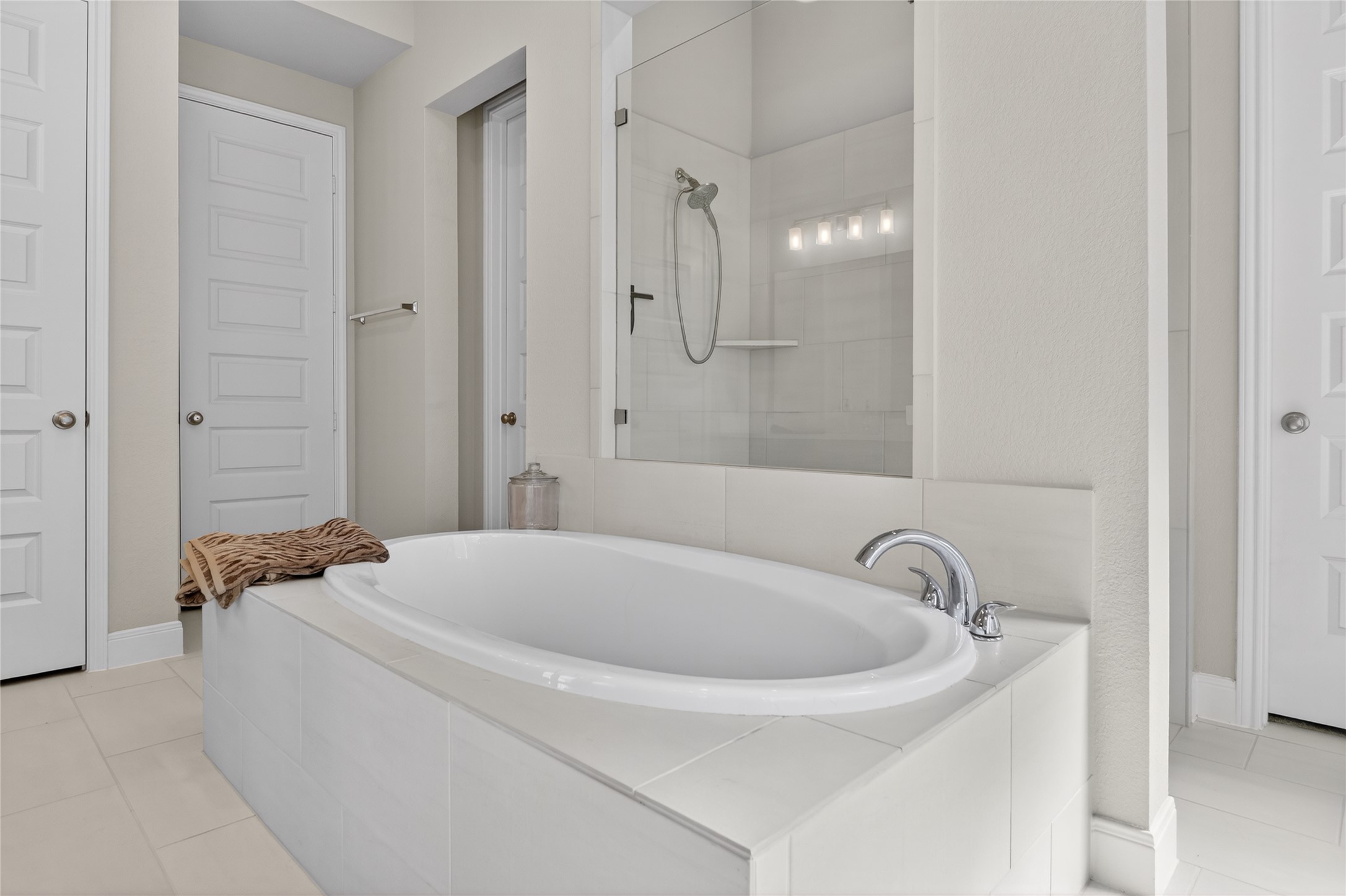 100 Peach Orch Lane Georgetown, TX 78628 - Photo 16 of 40 a bathroom with a tub a sink and a shower