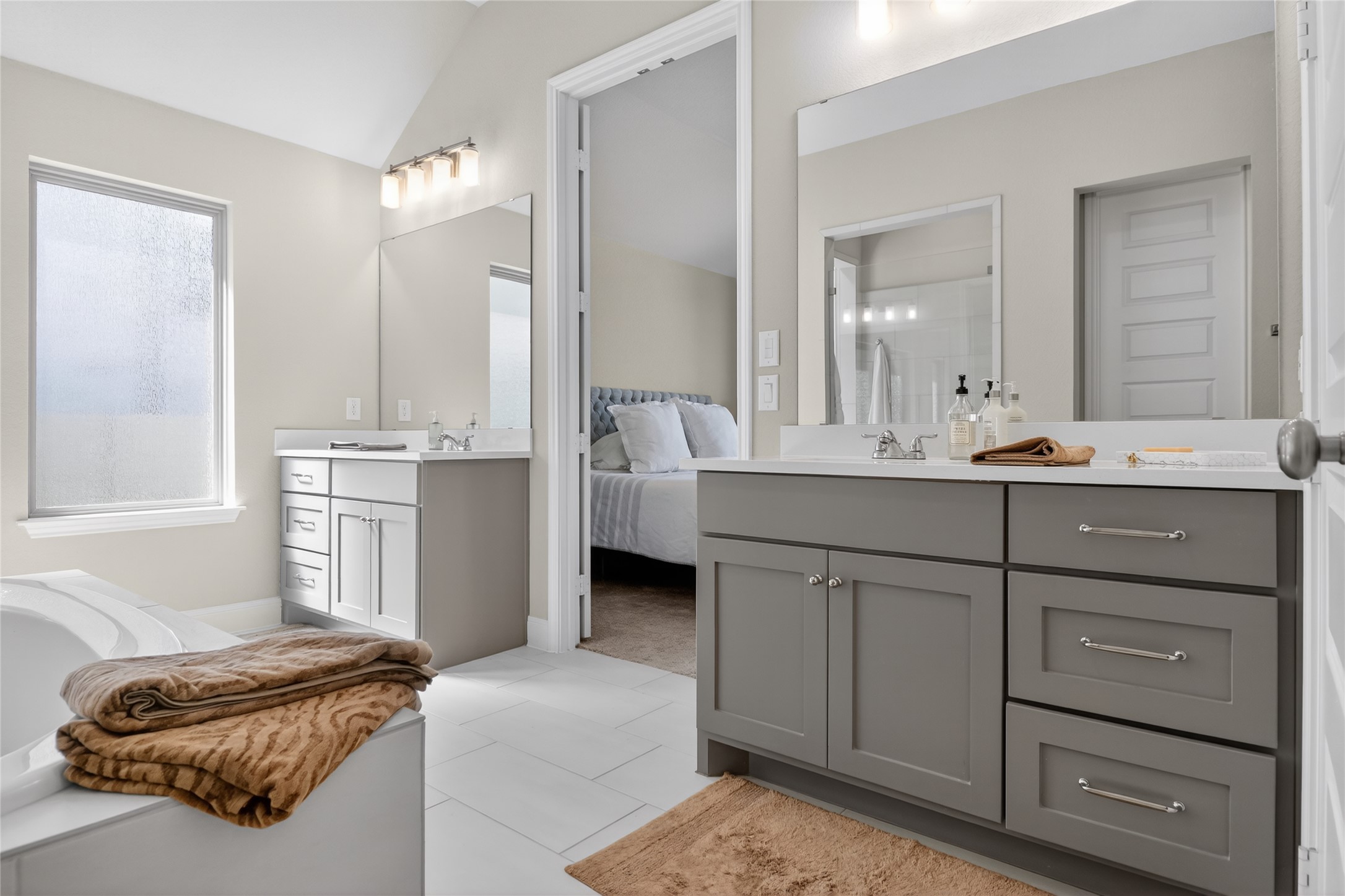 100 Peach Orch Lane Georgetown, TX 78628 - Photo 17 of 40 a en suite bathroom with a double vanity sink and mirror