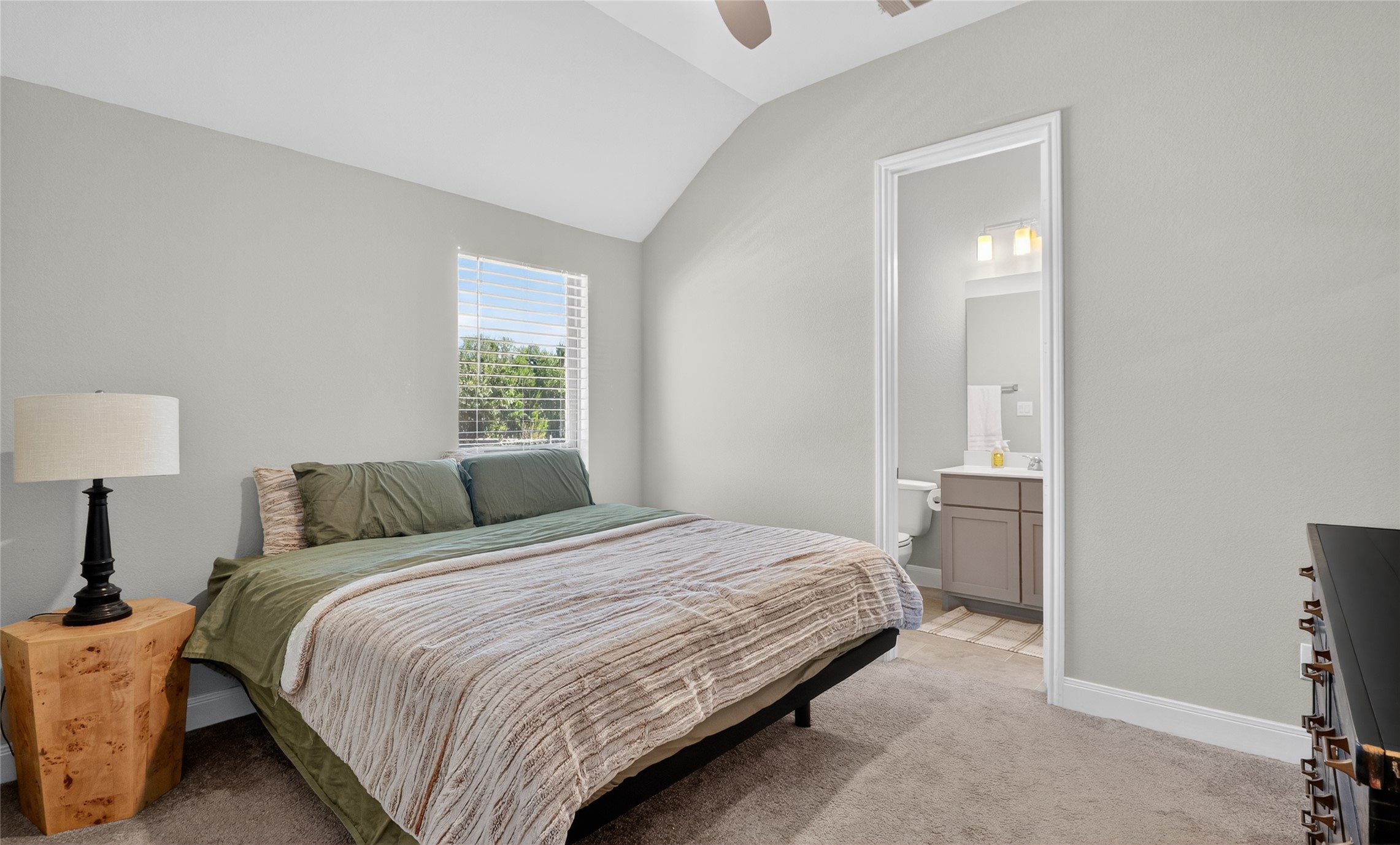 100 Peach Orch Lane Georgetown, TX 78628 - Photo 20 of 40 a bedroom with a bed and a lamp