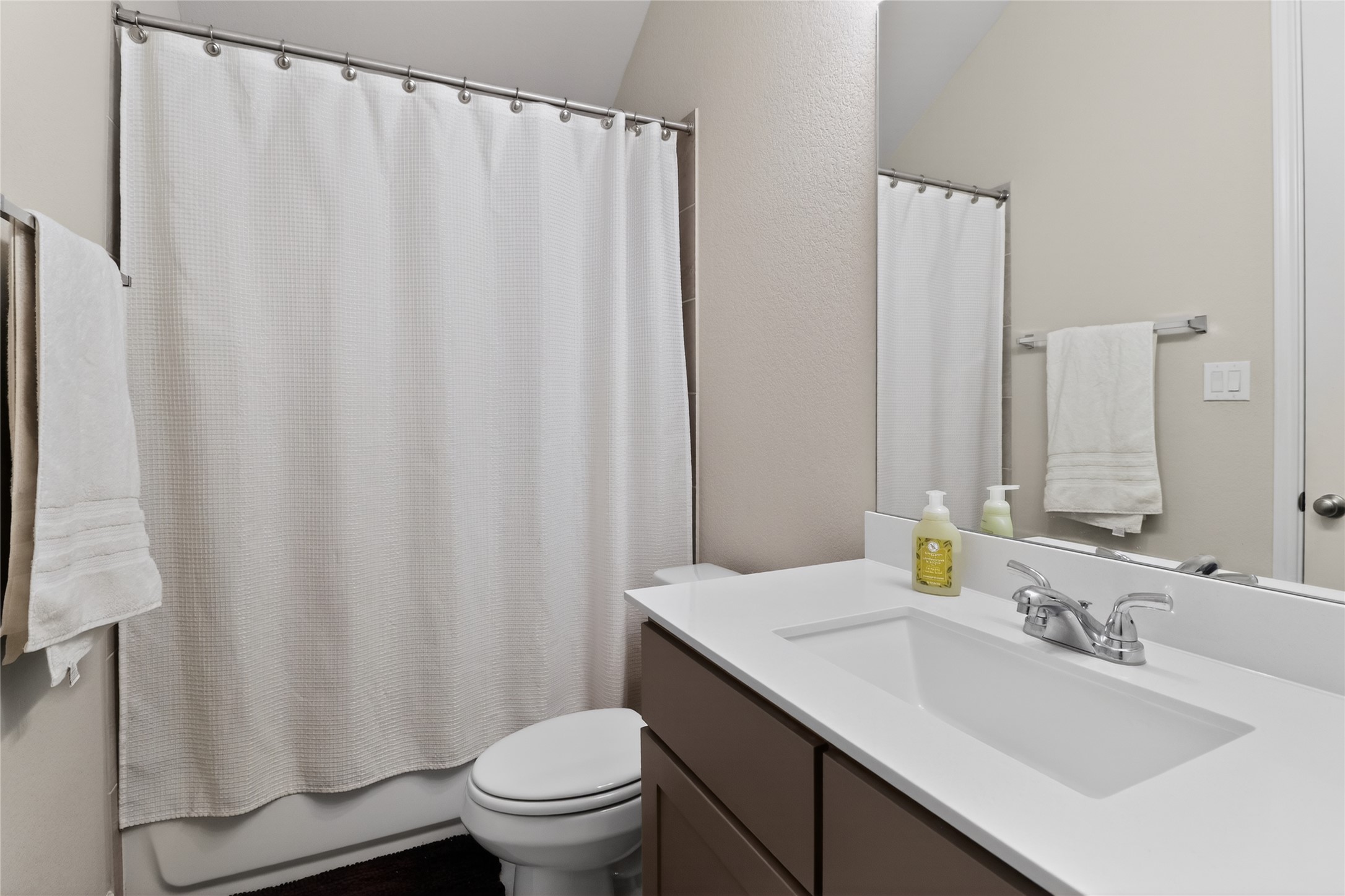 100 Peach Orch Lane Georgetown, TX 78628 - Photo 21 of 40 a bathroom with a sink toilet and mirror