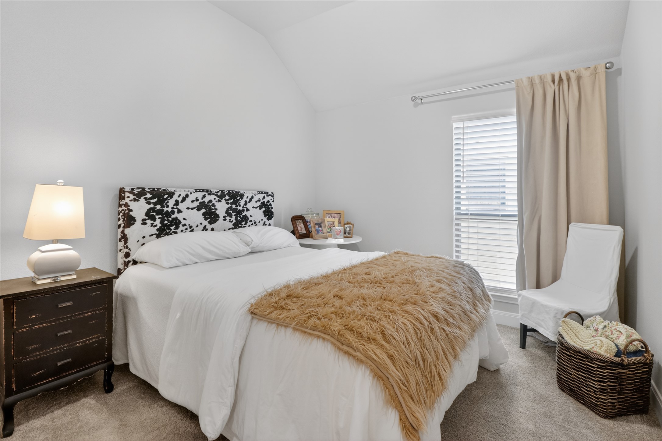 100 Peach Orch Lane Georgetown, TX 78628 - Photo 22 of 40 a bedroom with a bed a couch and chair