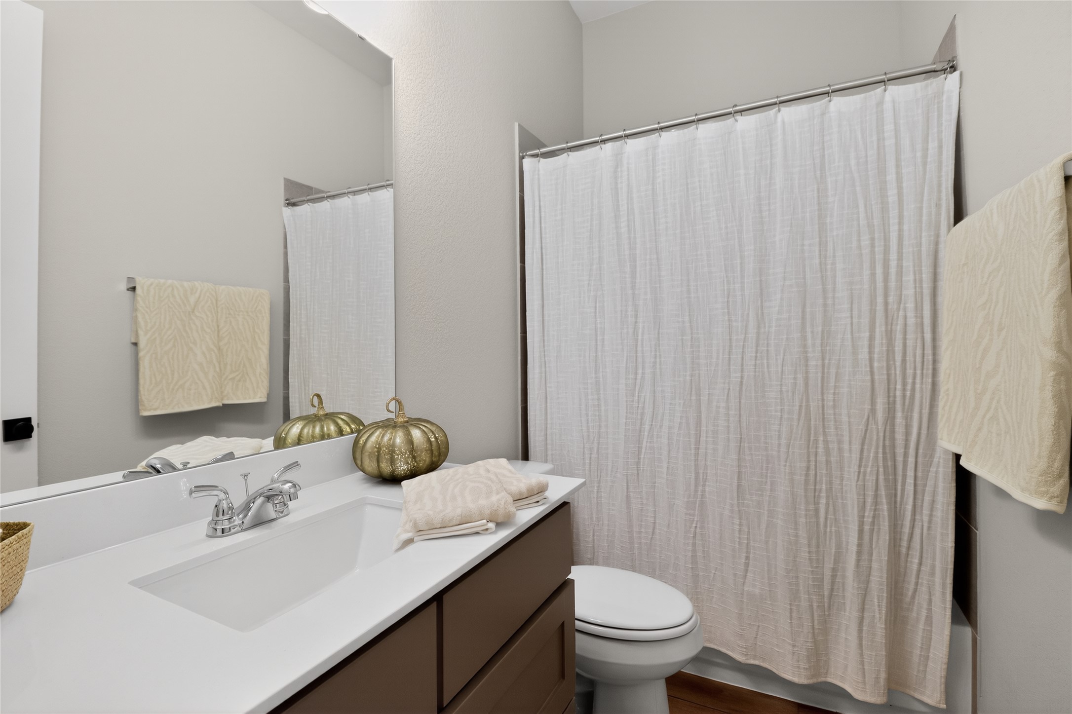 100 Peach Orch Lane Georgetown, TX 78628 - Photo 23 of 40 a bathroom with a granite countertop sink and a mirror
