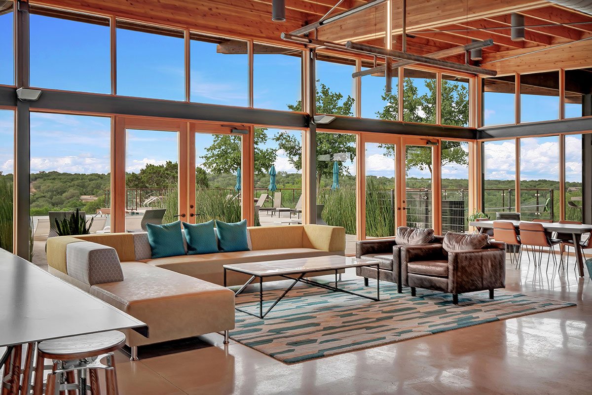 100 Peach Orch Lane Georgetown, TX 78628 - Photo 38 of 40 a living room with furniture large windows and wooden floor