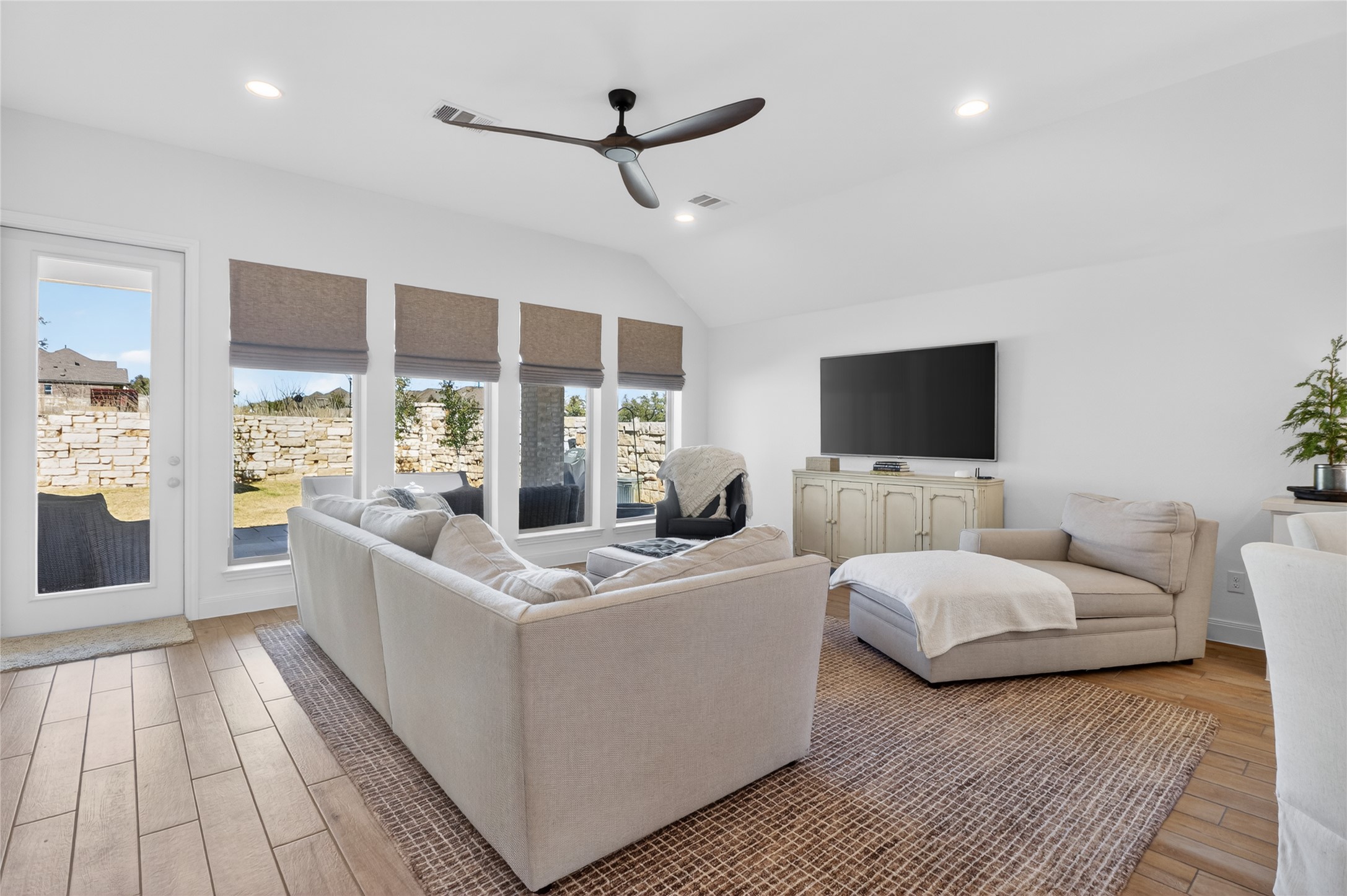 100 Peach Orch Lane Georgetown, TX 78628 - Photo 10 of 40 a living room with furniture and a flat screen tv