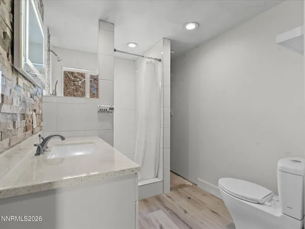 a bathroom with a sink toilet and vanity