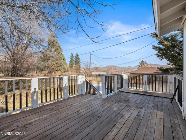a view of a balcony with wooden floor