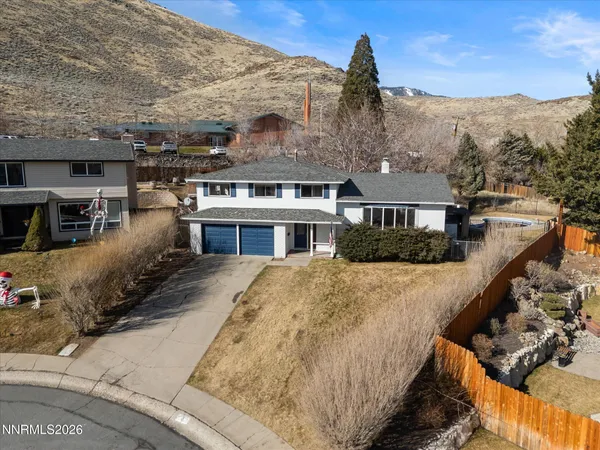 an aerial view of house with a yard