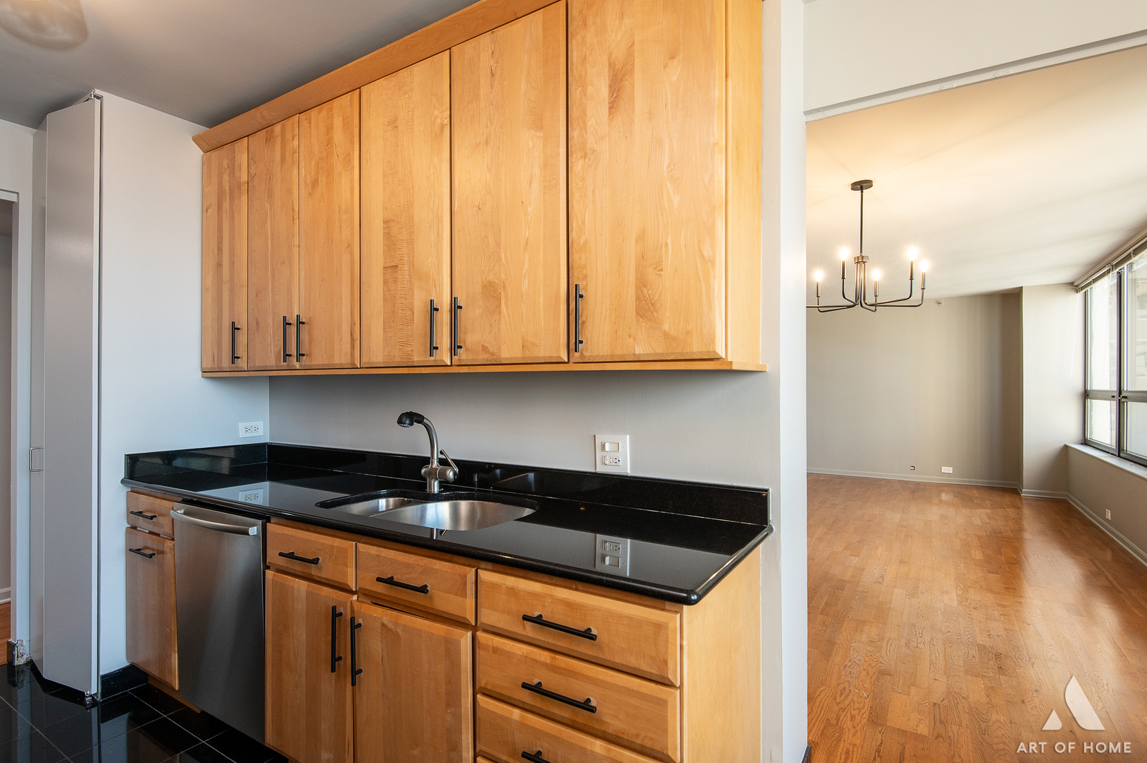 400 East Ohio Street, Unit 2302 Chicago, IL 60611 - Photo 12 of 38 a kitchen with granite countertop a sink and cabinets