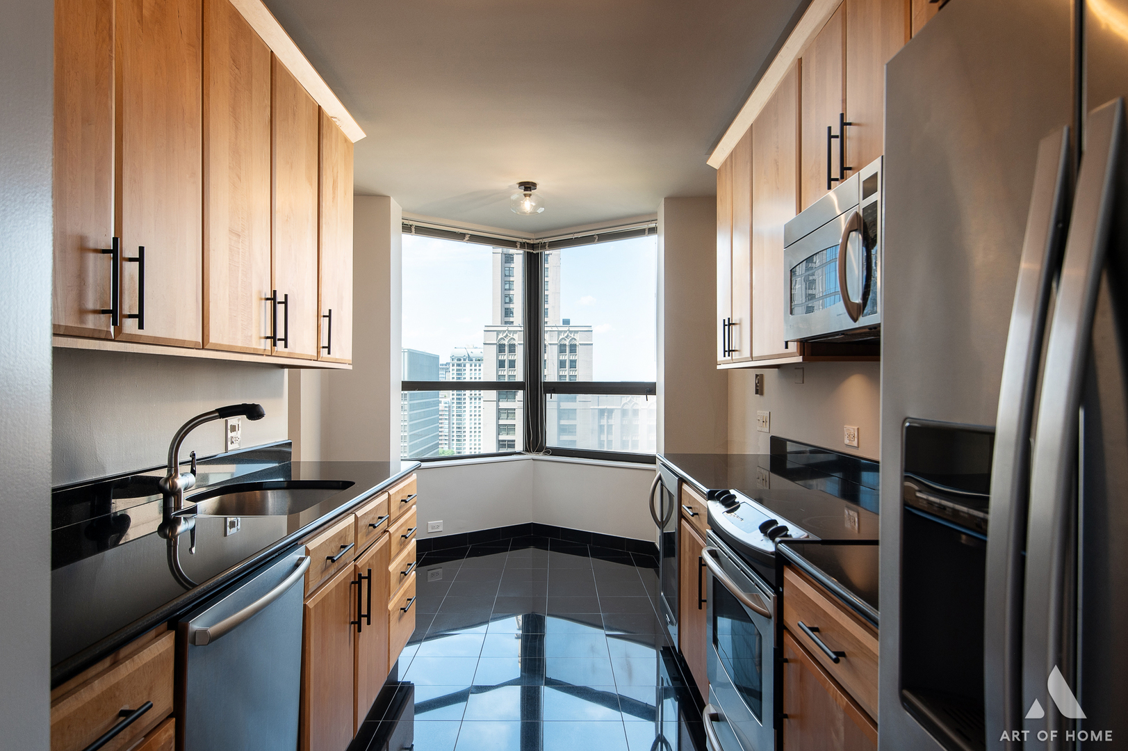 400 East Ohio Street, Unit 2302 Chicago, IL 60611 - Photo 15 of 38 a kitchen with stainless steel appliances a sink stove and cabinets