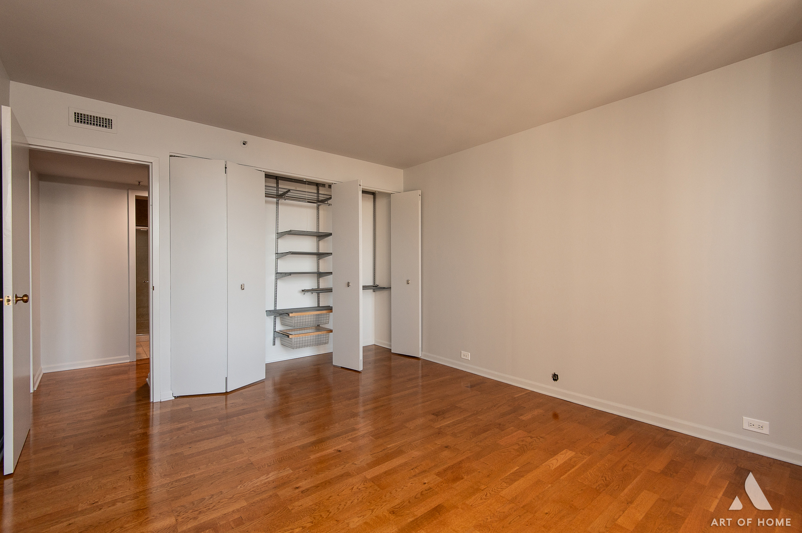 400 East Ohio Street, Unit 2302 Chicago, IL 60611 - Photo 24 of 38 a view of empty room with wooden floor