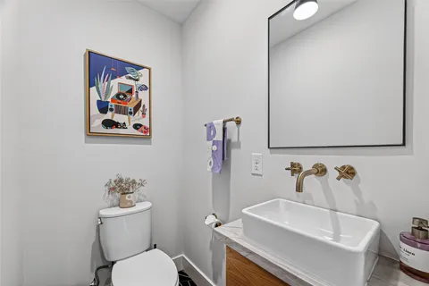 a view of a storage and utility room with washer and dryer