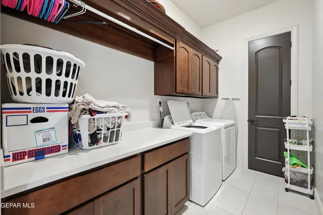 a kitchen with a sink and a refrigerator