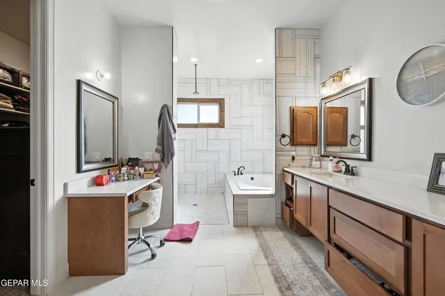 a bathroom with a sink mirror vanity and toilet