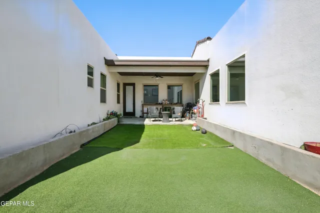 a view of an house with backyard porch and outdoor space