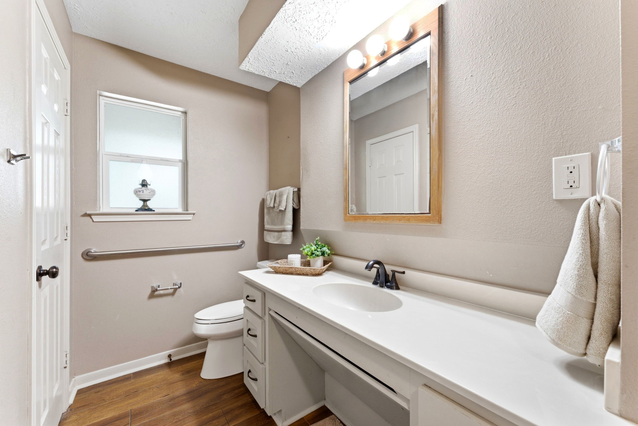 2354 Hickory Hollow Lane Spring, TX 77386 - Photo 4 of 11 a bathroom with a sink a toilet and mirror