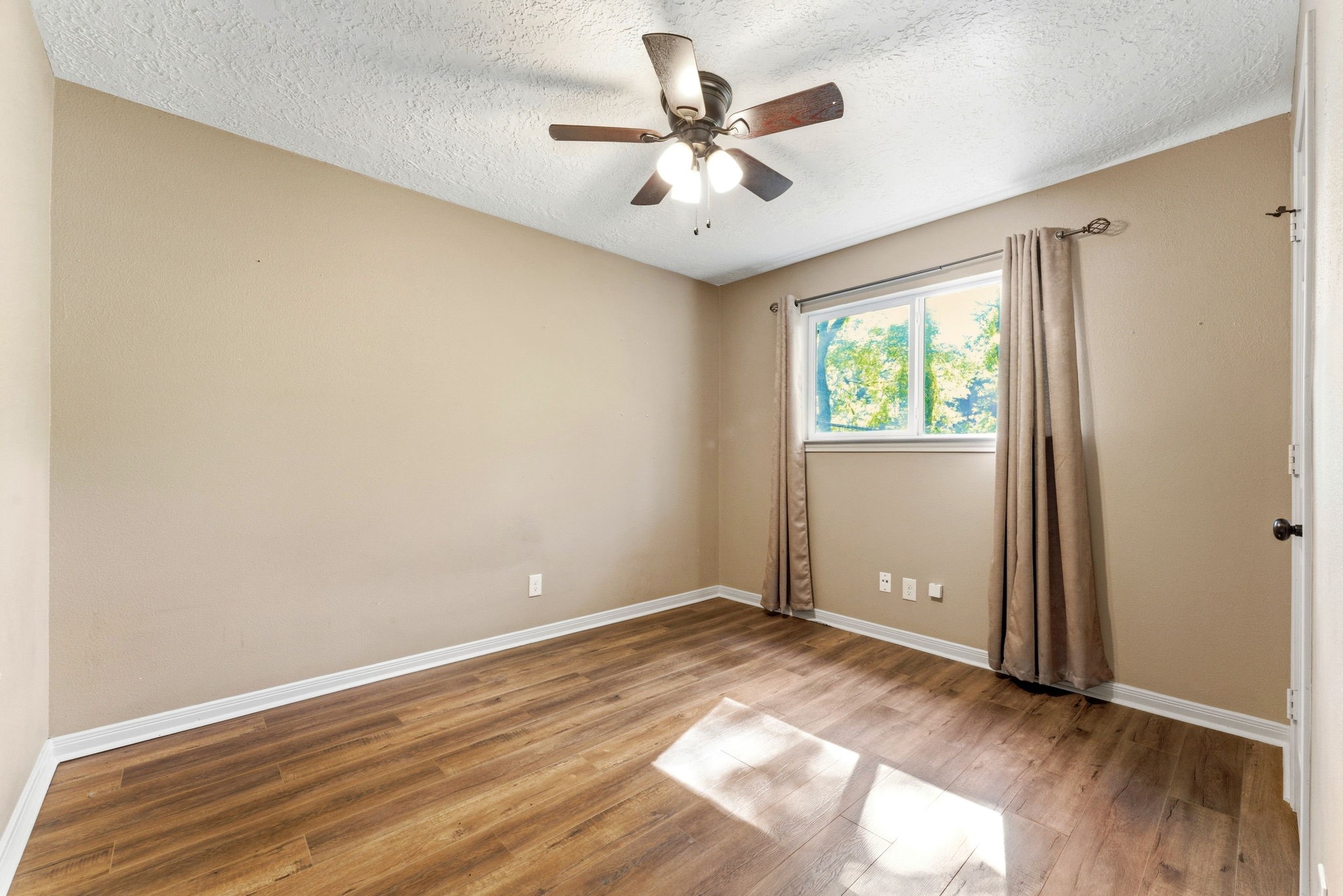 2354 Hickory Hollow Lane Spring, TX 77386 - Photo 5 of 11 a view of room with window and ceiling fan