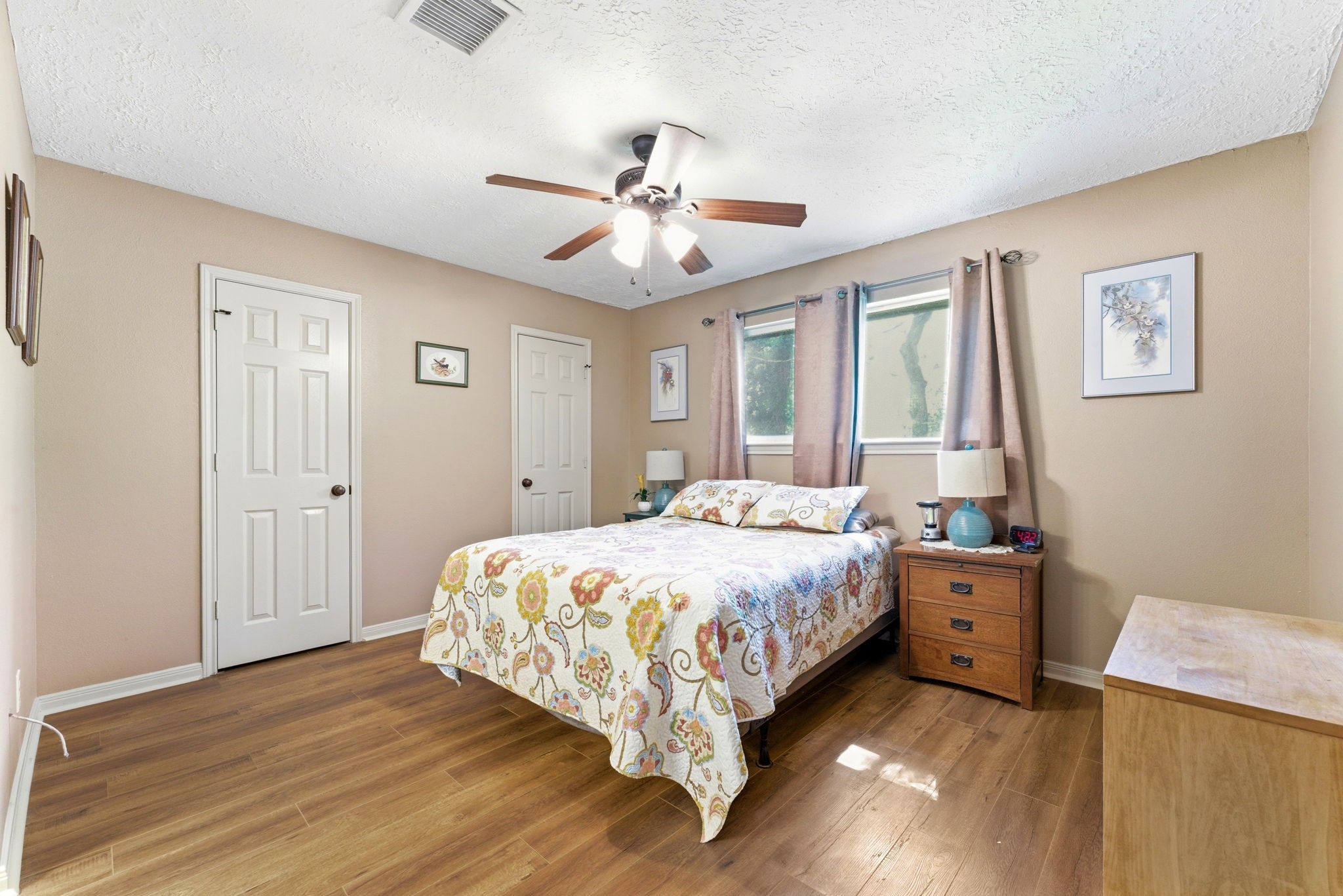 2354 Hickory Hollow Lane Spring, TX 77386 - Photo 8 of 11 a bedroom with a bed and wooden floor