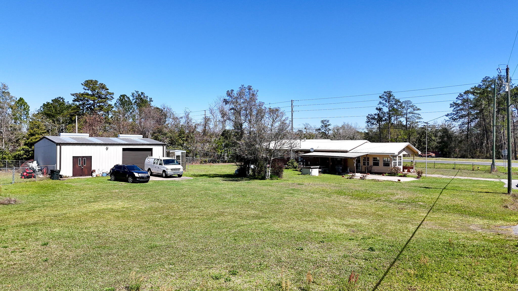 40 Jones Drive Freeport, FL 32439 - Photo 7 of 12 a view of a house with backyard and porch