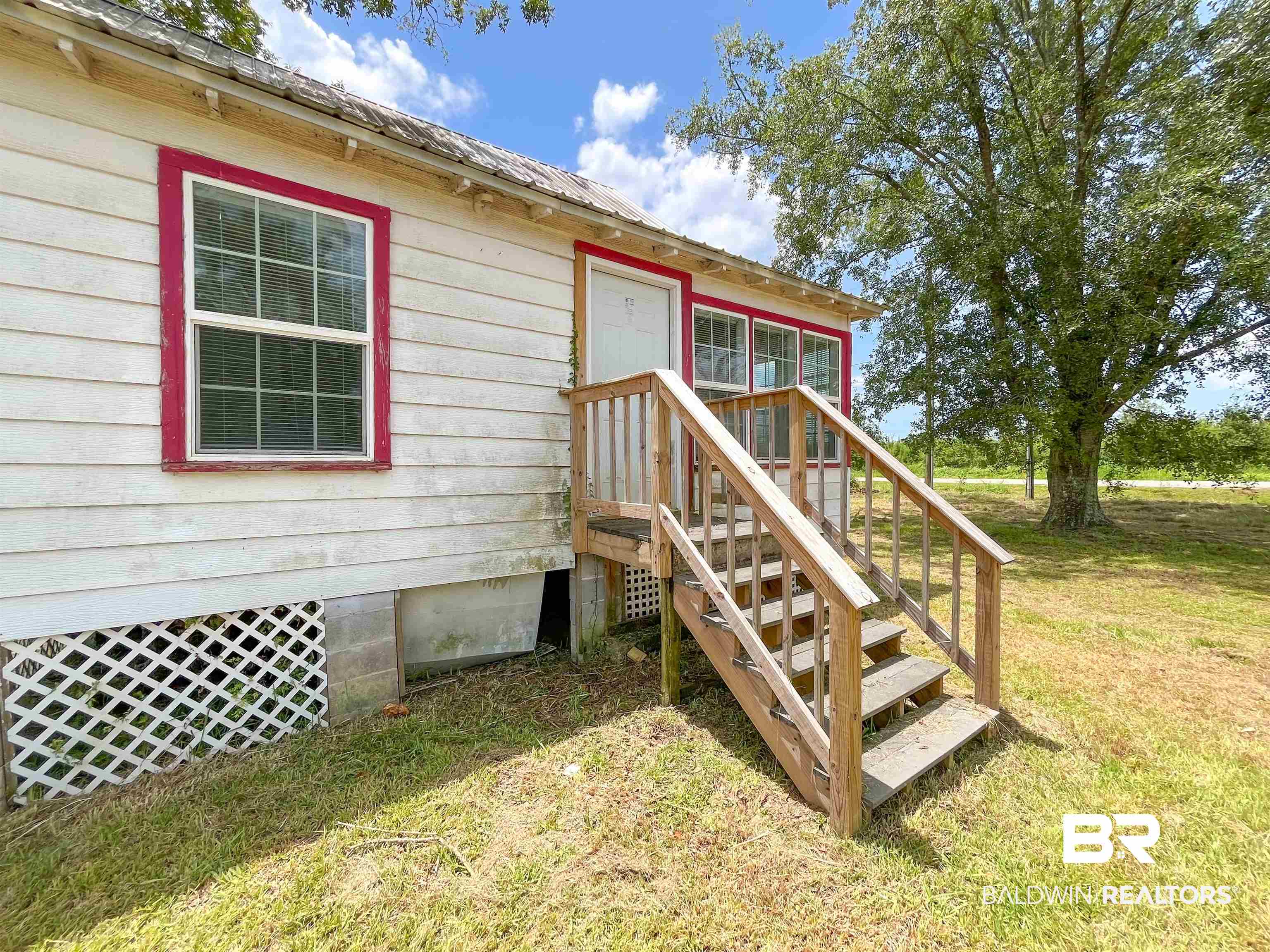 12956 Bender Road Foley, AL 36535 - Photo 4 of 46 Doorway to property featuring a lawn