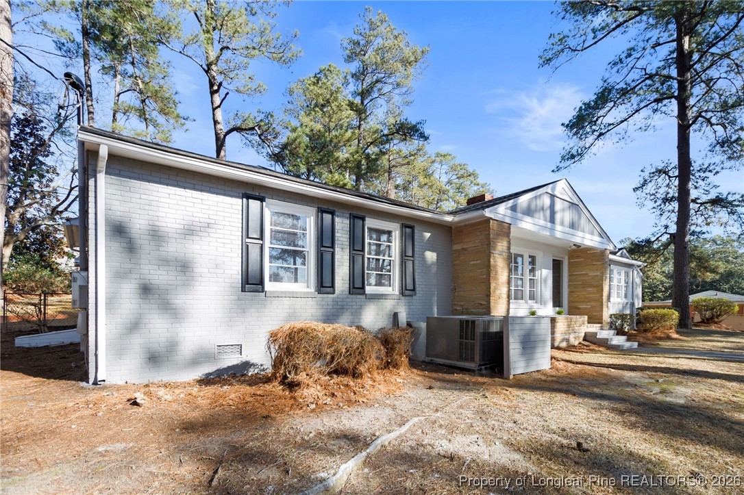 2712 Morganton Road Fayetteville, NC 28303 - Photo 2 of 39 a view of a house with a yard covered in snow