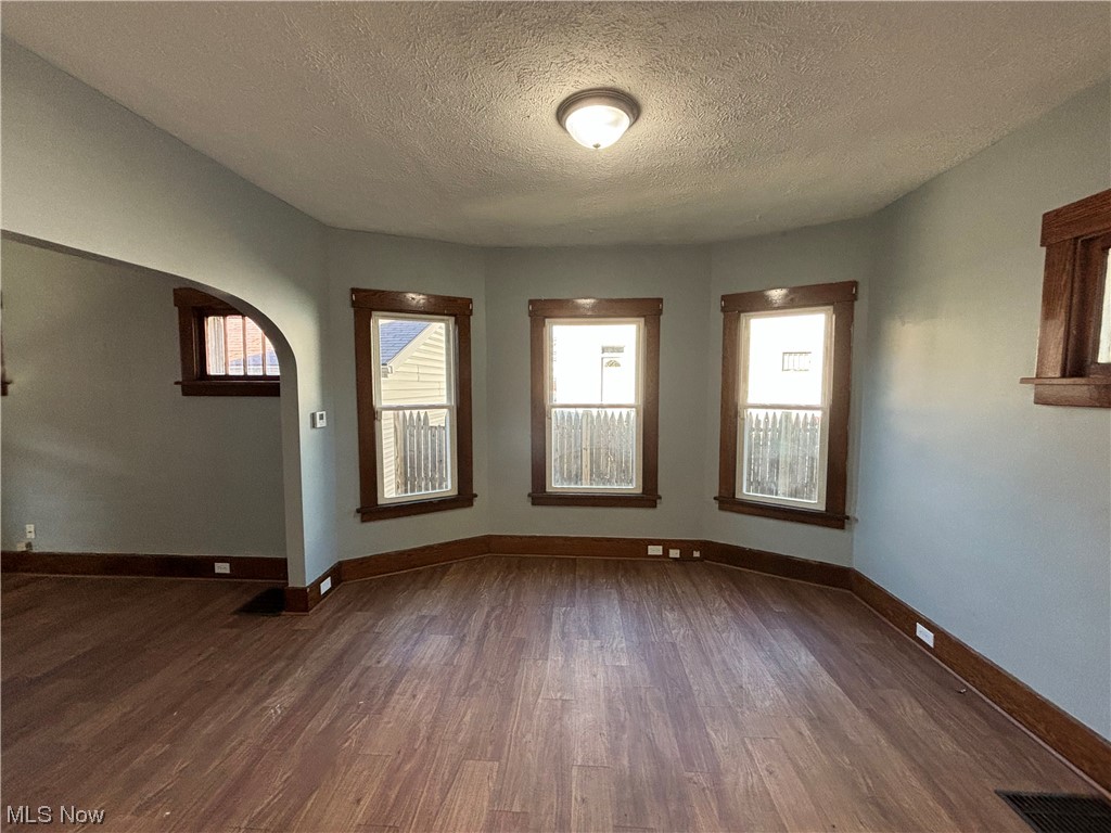 2711 11th Street Northwest Canton, OH 44708 - Photo 12 of 16 Unfurnished room with a textured ceiling and wood-type flooring