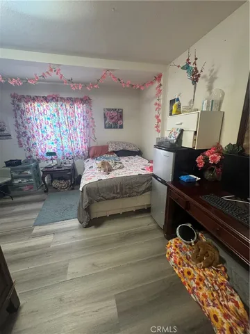 a bedroom with bed and window