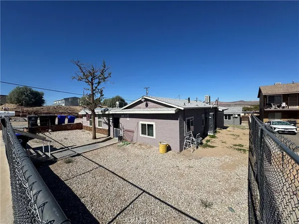 a view of a house with wooden deck
