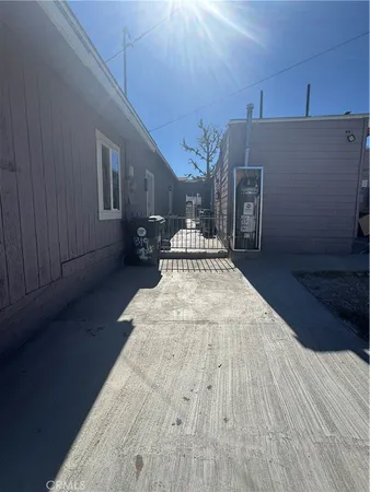 a spacious bedroom with a bed and wooden floor