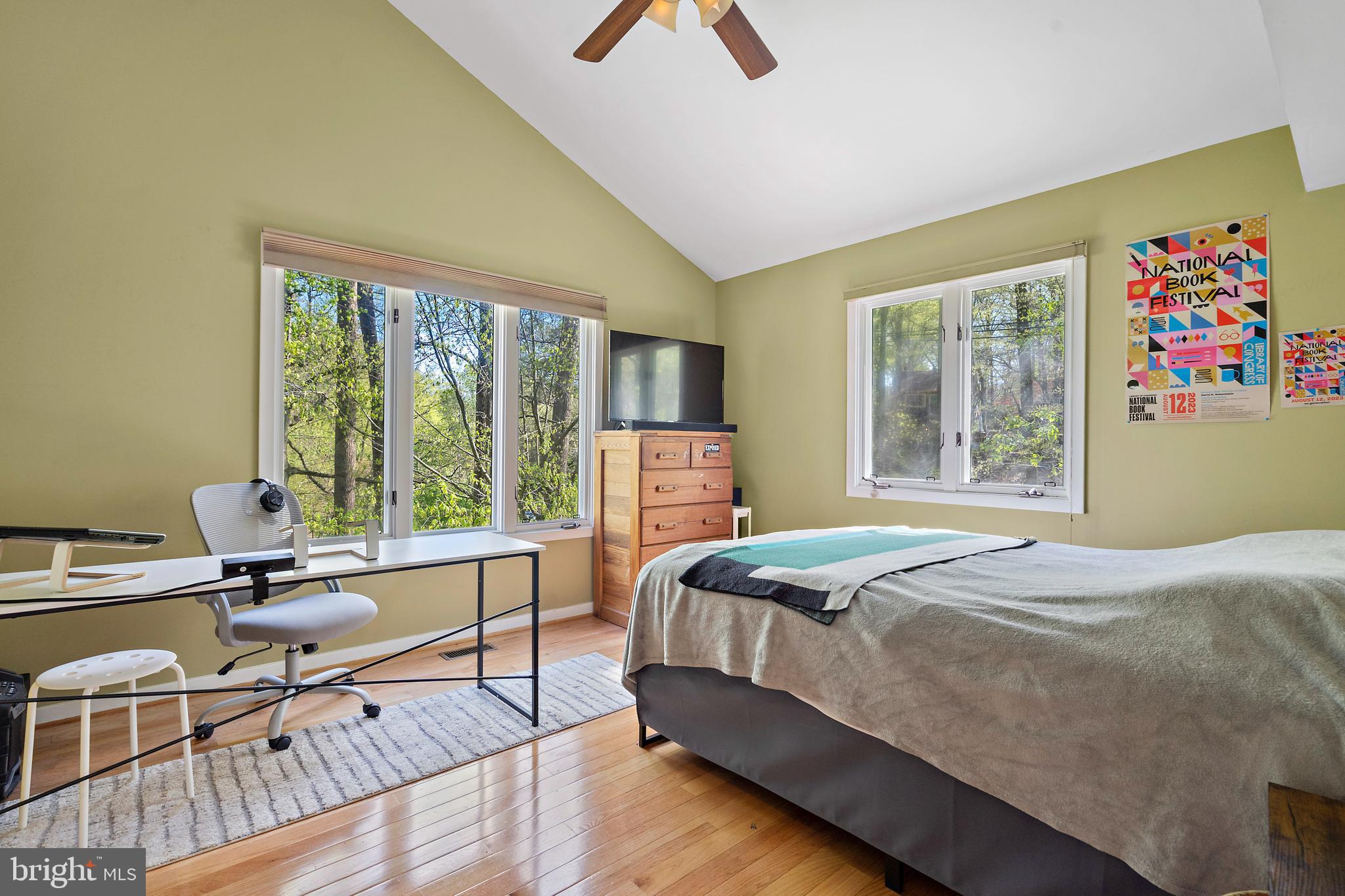 132 Hilltop Road Silver Spring, MD 20910 - Photo 15 of 50 a bedroom with a bed and large windows
