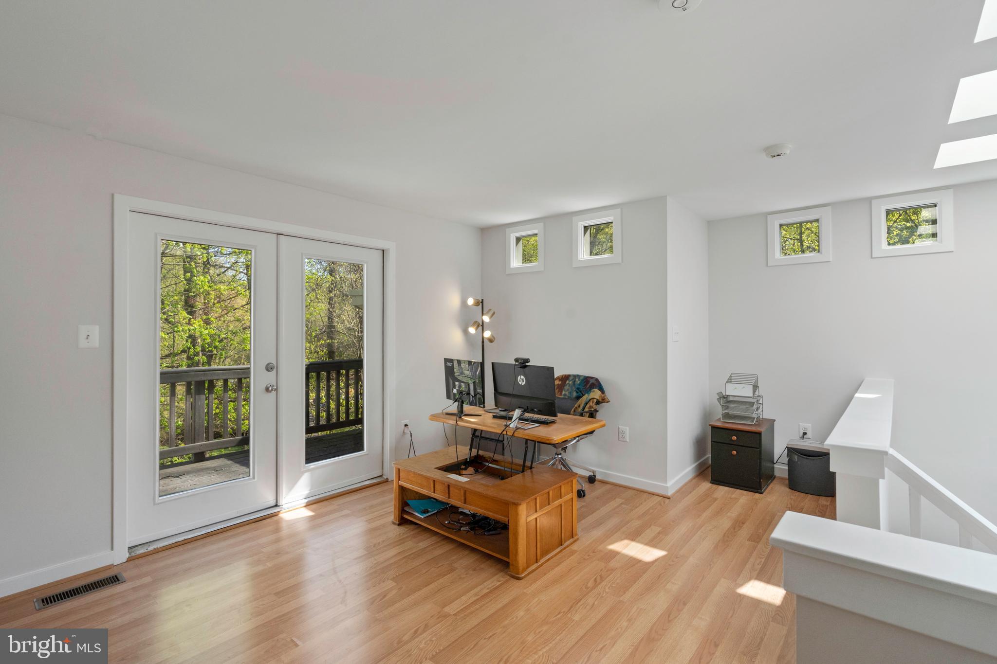 132 Hilltop Road Silver Spring, MD 20910 - Photo 26 of 50 a living room with furniture and large windows