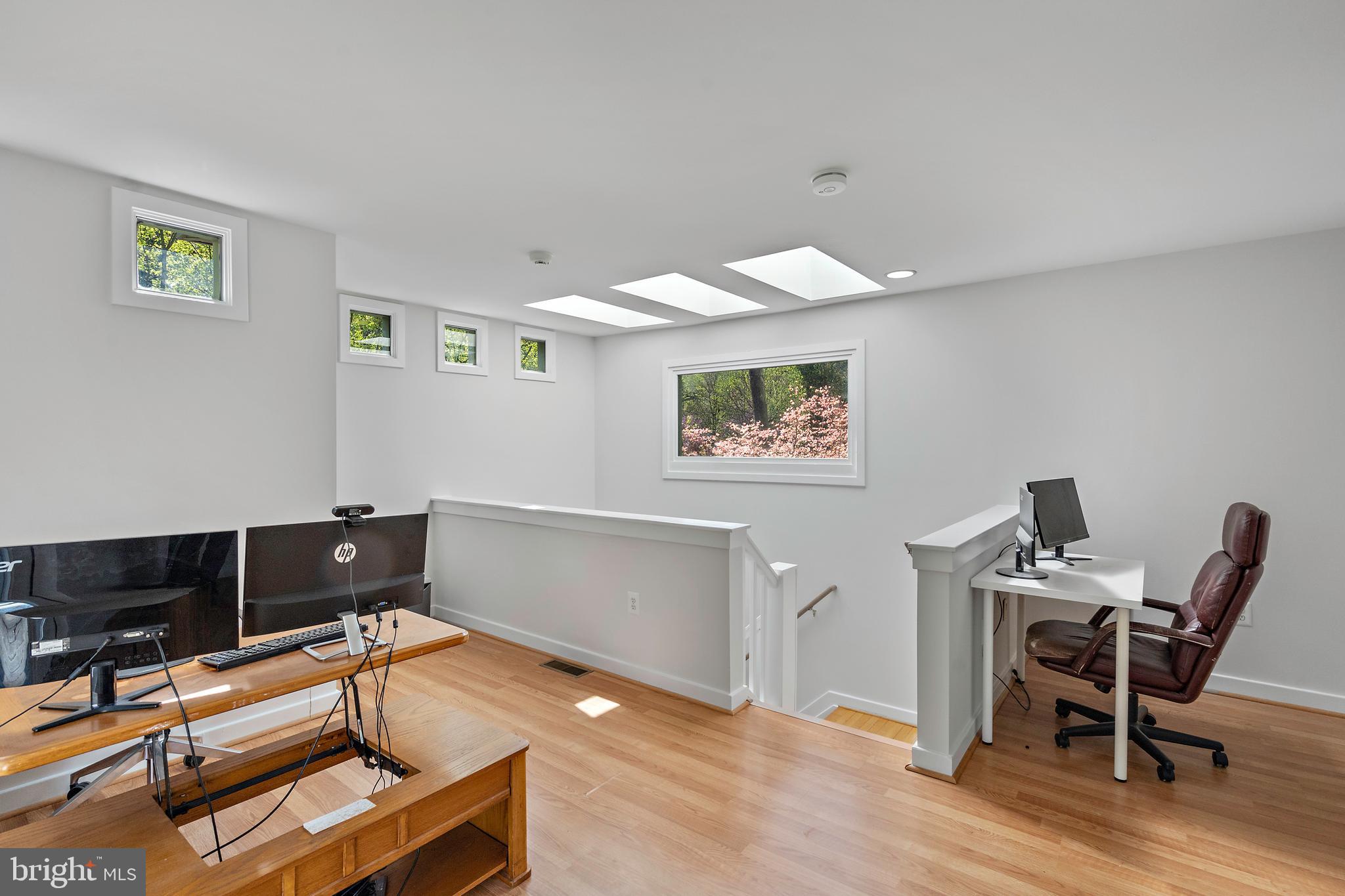 132 Hilltop Road Silver Spring, MD 20910 - Photo 27 of 50 a workspace with furniture and wooden floor