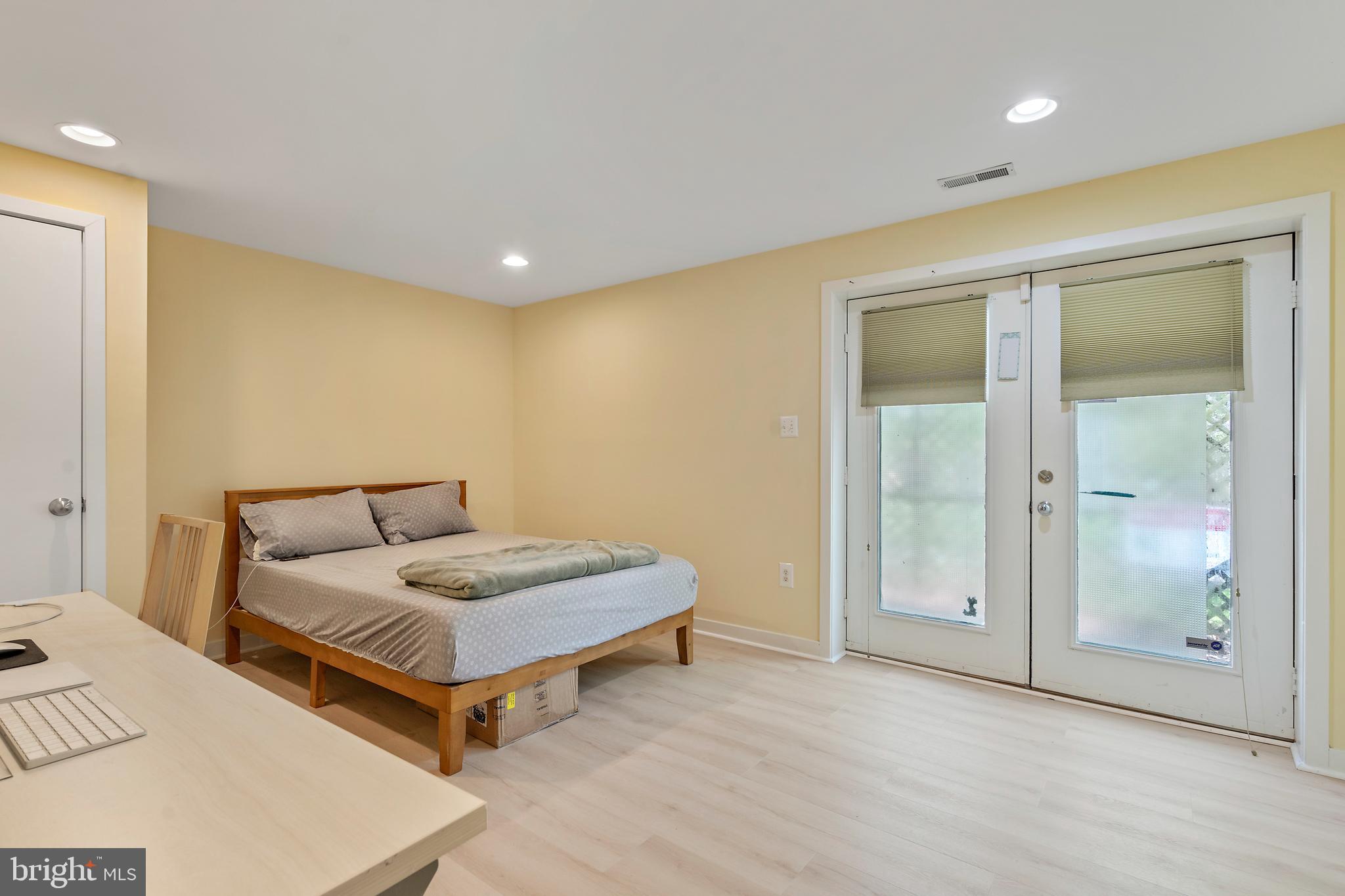 132 Hilltop Road Silver Spring, MD 20910 - Photo 28 of 50 a living room with a bed and a walk in closet