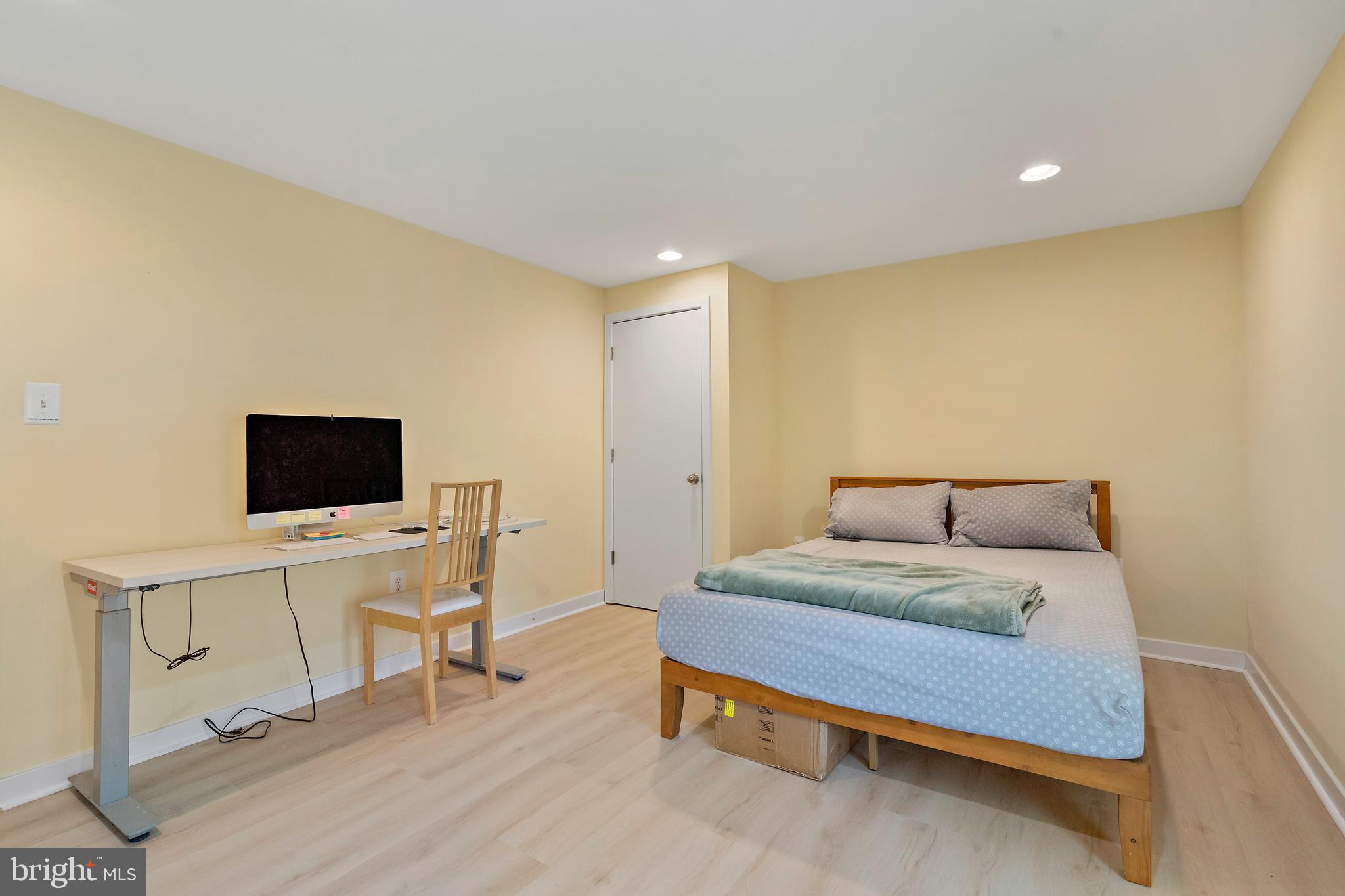 132 Hilltop Road Silver Spring, MD 20910 - Photo 29 of 50 a bedroom with a bed and a flat screen tv