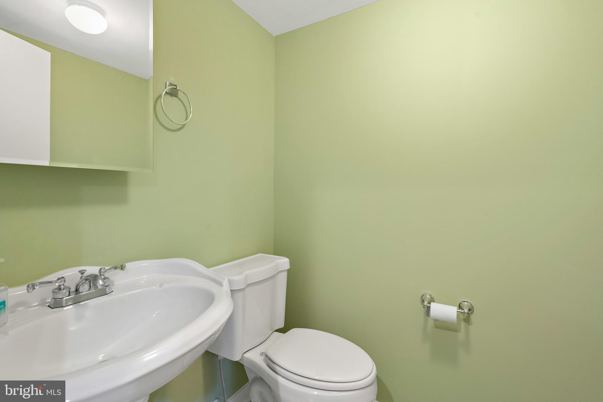 132 Hilltop Road Silver Spring, MD 20910 - Photo 30 of 50 a bathroom with a sink mirror vanity and toilet