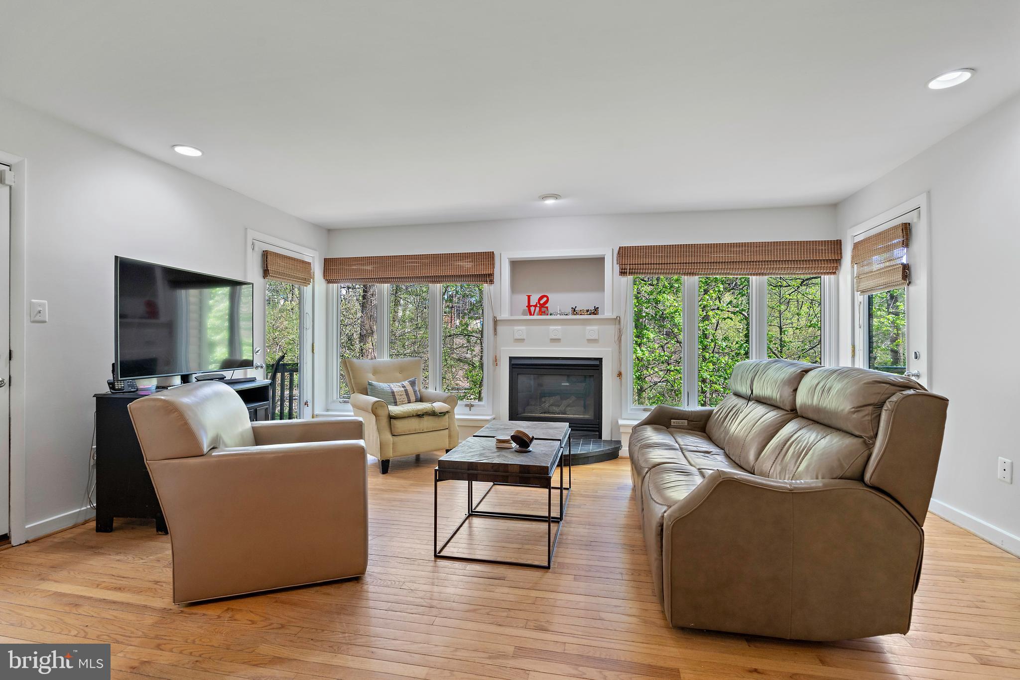 132 Hilltop Road Silver Spring, MD 20910 - Photo 3 of 50 a living room with furniture and a fireplace