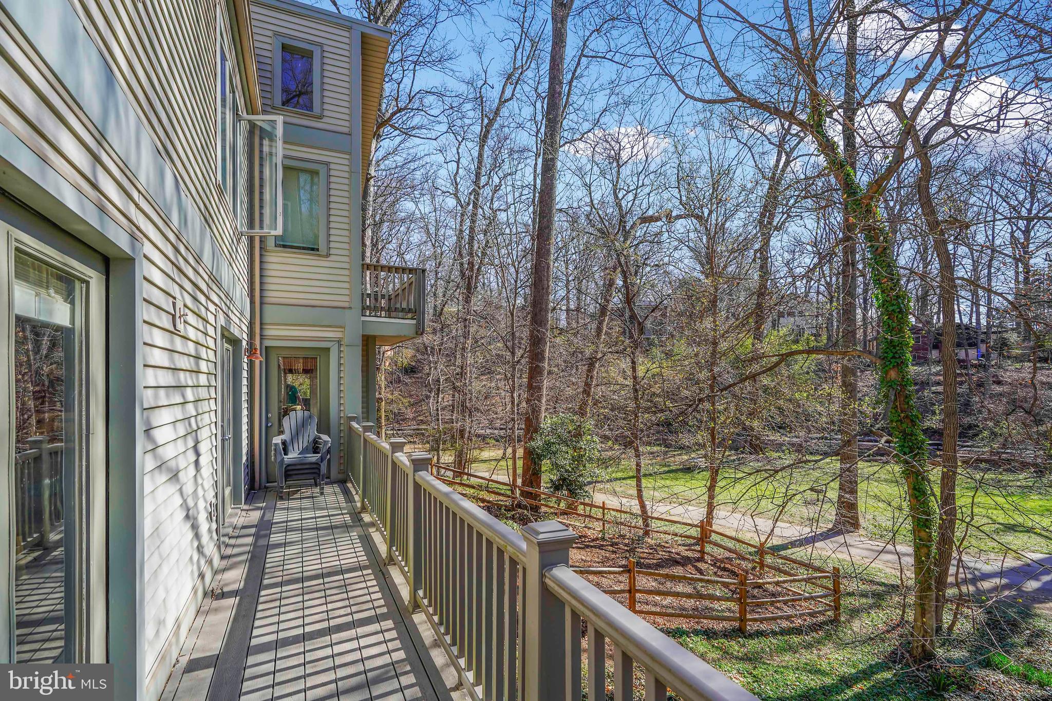132 Hilltop Road Silver Spring, MD 20910 - Photo 36 of 50 a view of a balcony with wooden floor and fence