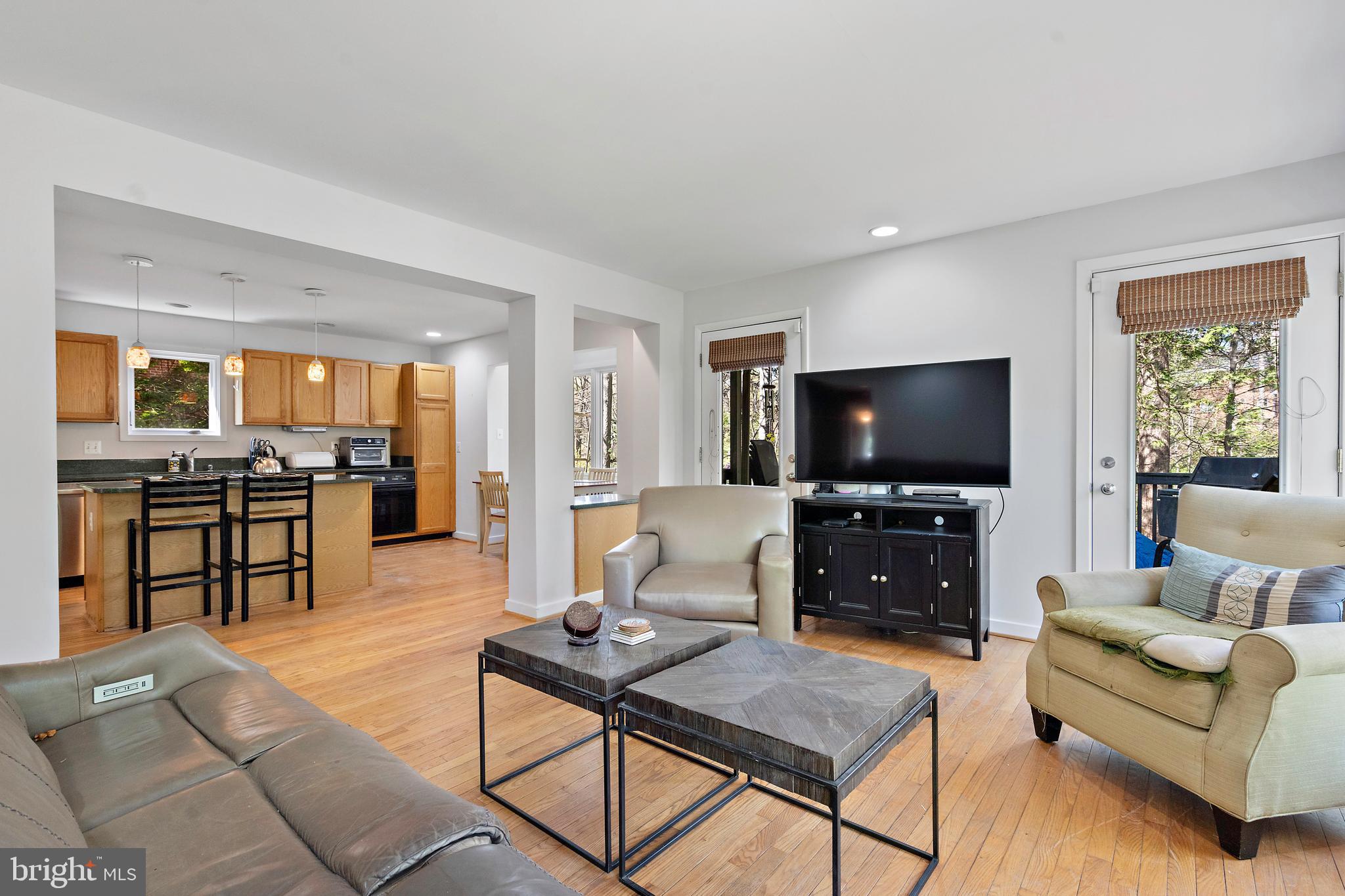 132 Hilltop Road Silver Spring, MD 20910 - Photo 4 of 50 a living room with furniture and a flat screen tv