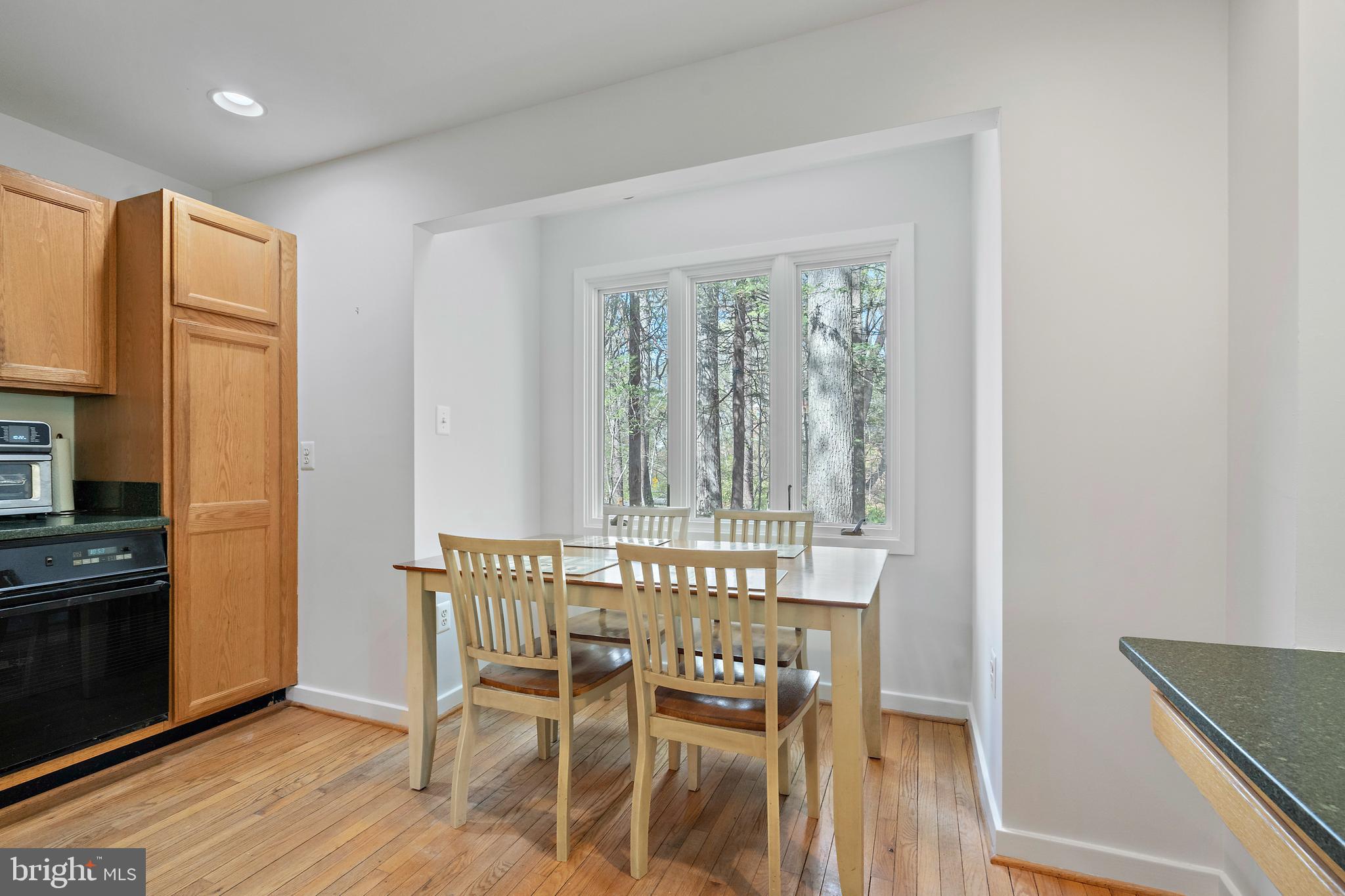 132 Hilltop Road Silver Spring, MD 20910 - Photo 8 of 50 a view of a dining room with furniture window and wooden floor