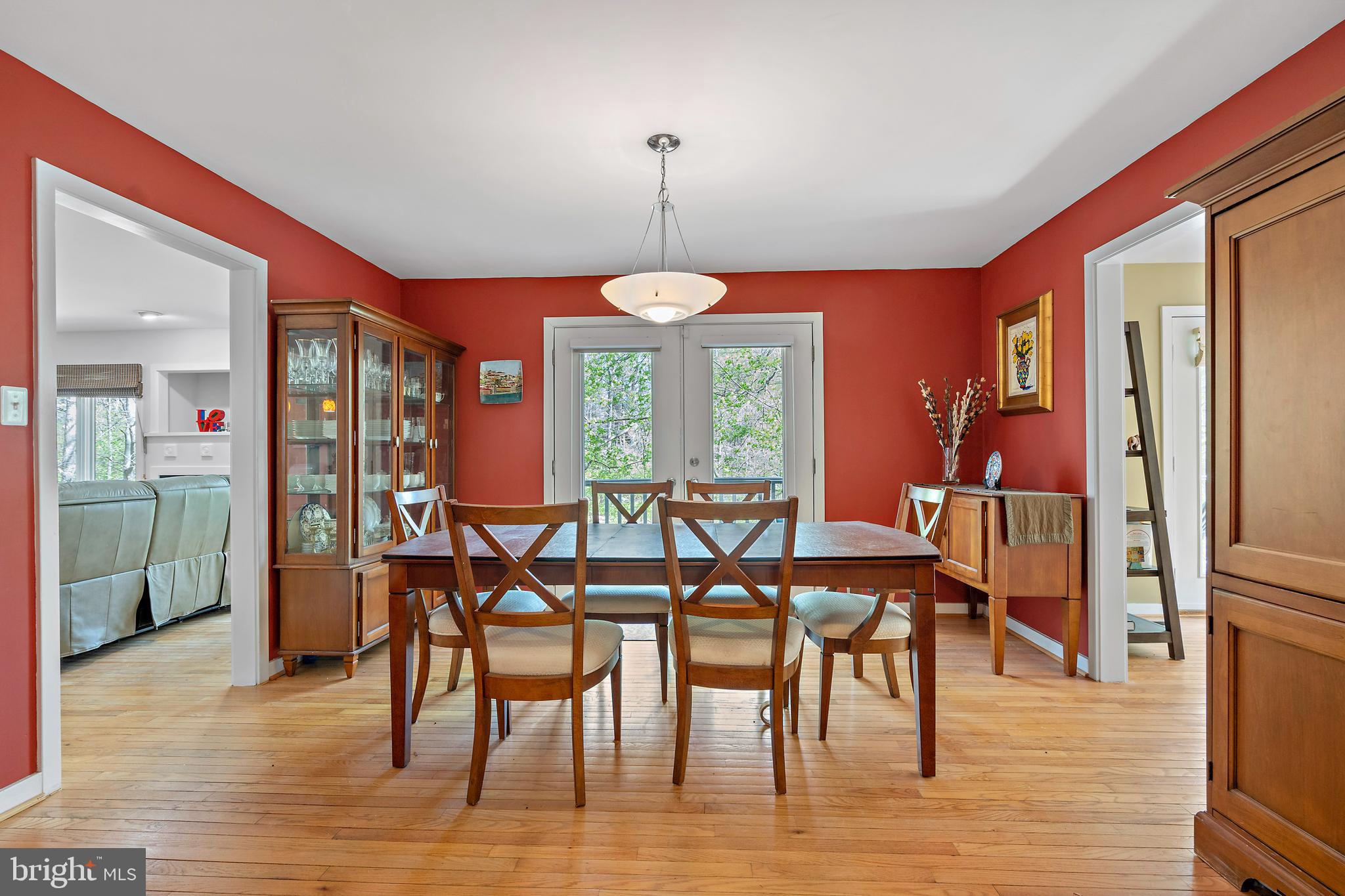132 Hilltop Road Silver Spring, MD 20910 - Photo 9 of 50 a dining room with furniture a chandelier and wooden floor