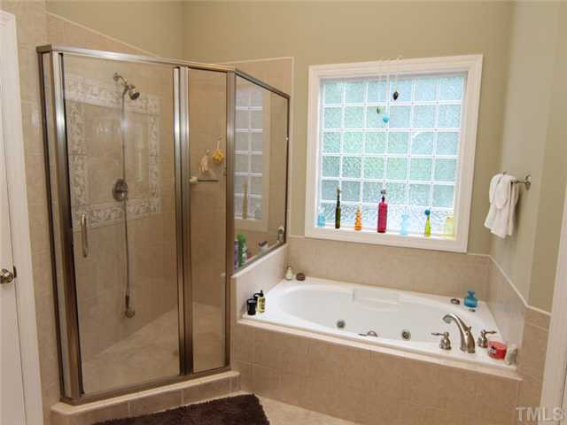 7305 Sparhawk Road Wake Forest, NC 27587 - Photo 12 of 25 LARGE CUSTOM SHOWER AND JETTED TUB. BEAUTIFUL TILE AND OPAQUE WINDOW. Master Bath/Spa